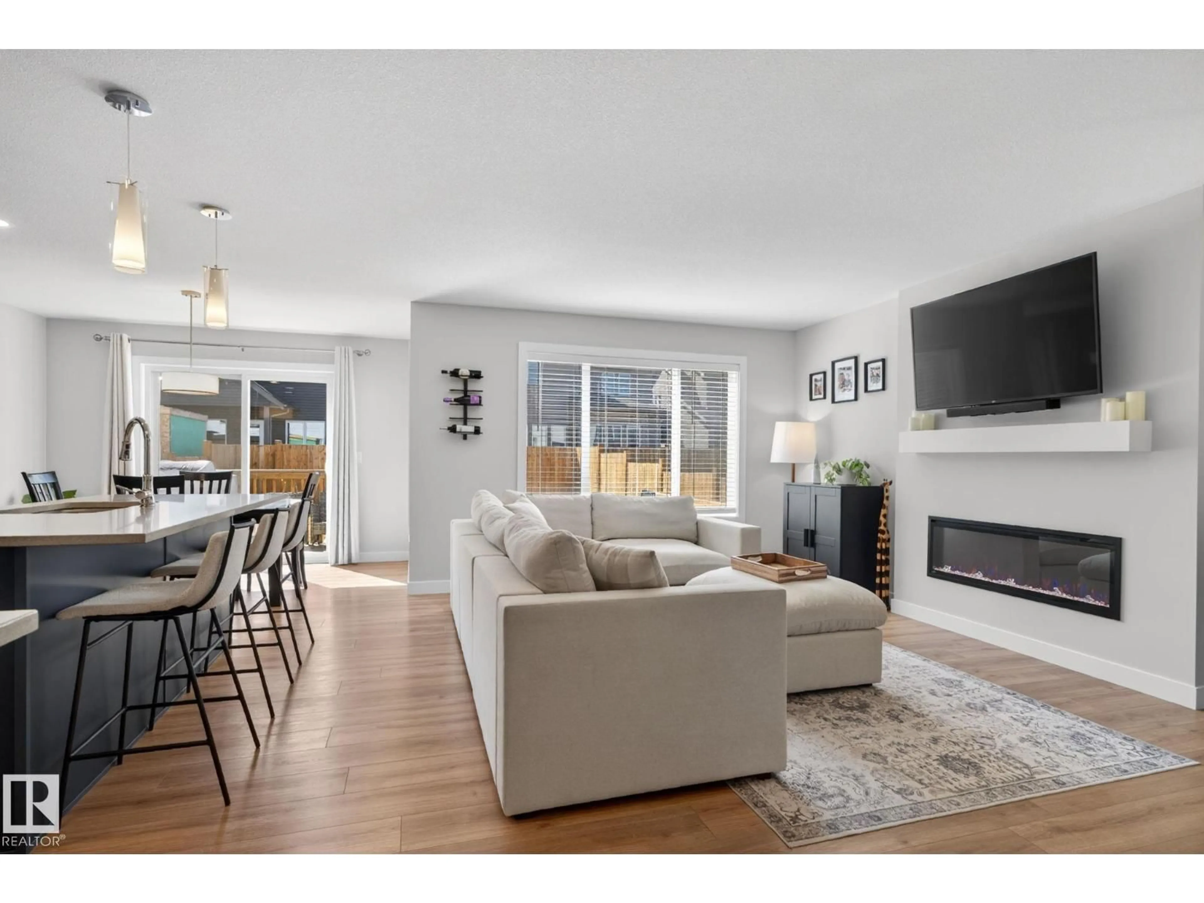 Living room with furniture, wood/laminate floor for 77 PENN PL, Spruce Grove Alberta T7X2W7