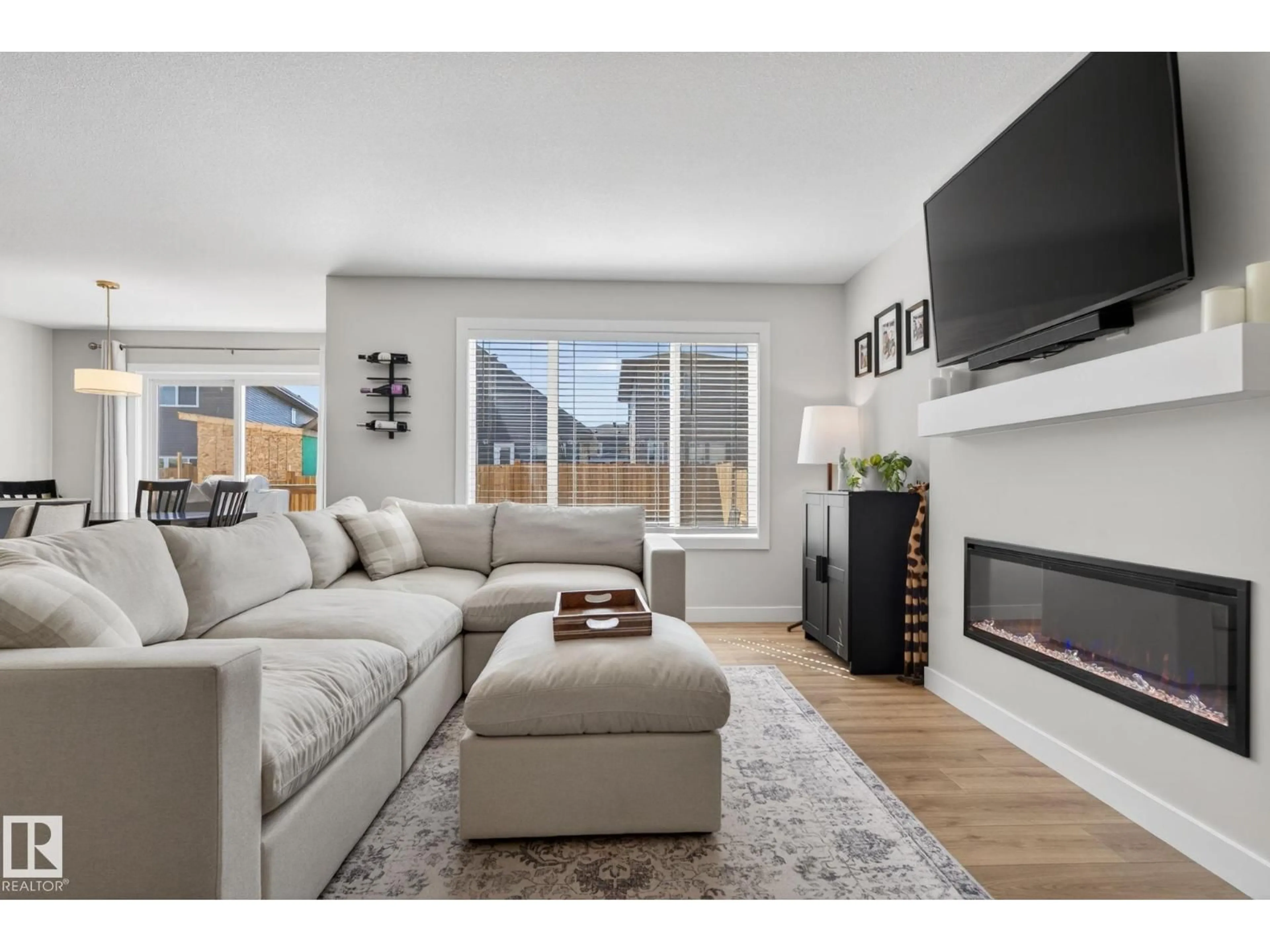 Living room with furniture, wood/laminate floor for 77 PENN PL, Spruce Grove Alberta T7X2W7