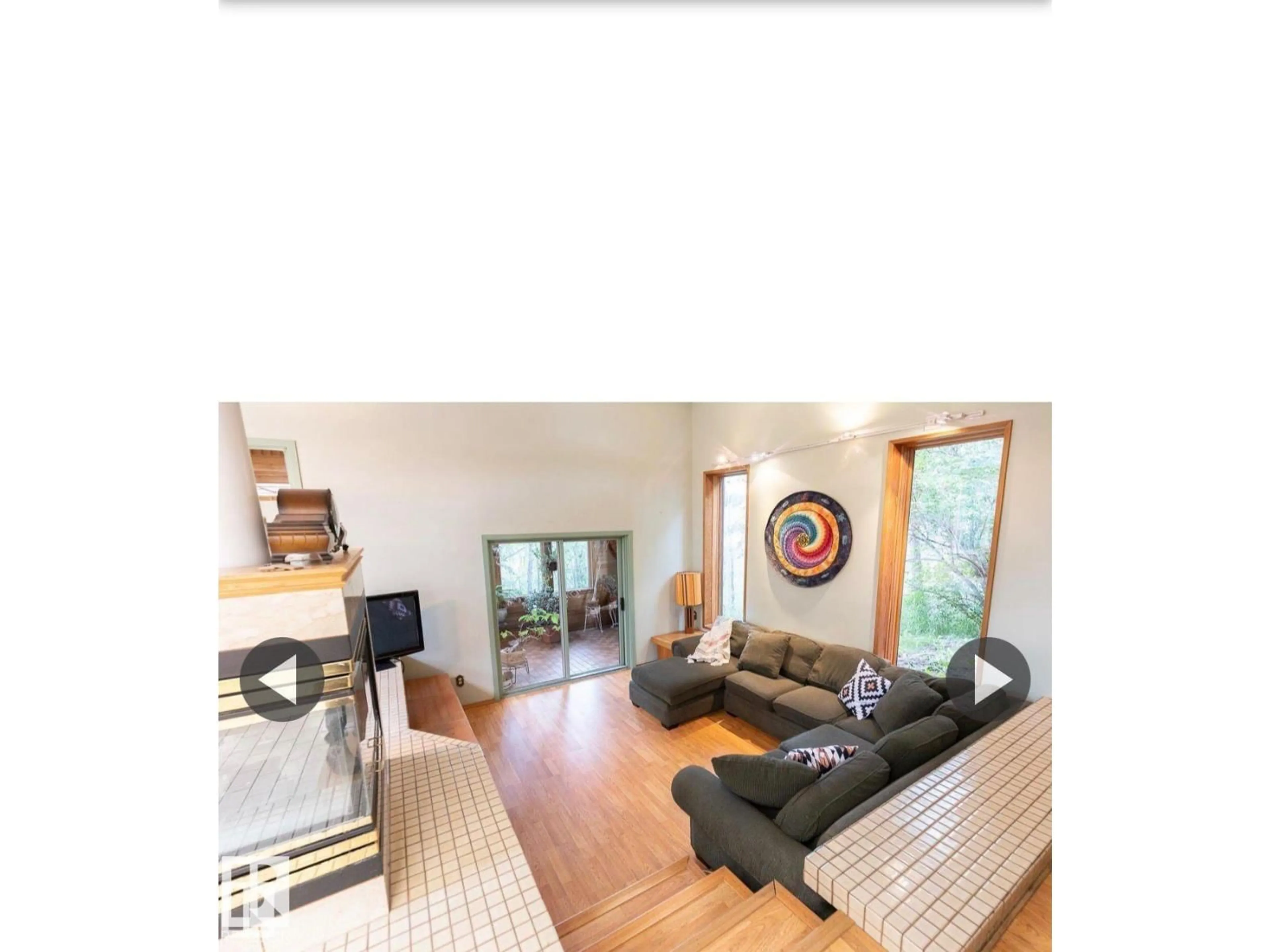 Living room with furniture, wood/laminate floor for 23248 TWP ROAD 522, Rural Strathcona County Alberta T8B1H5