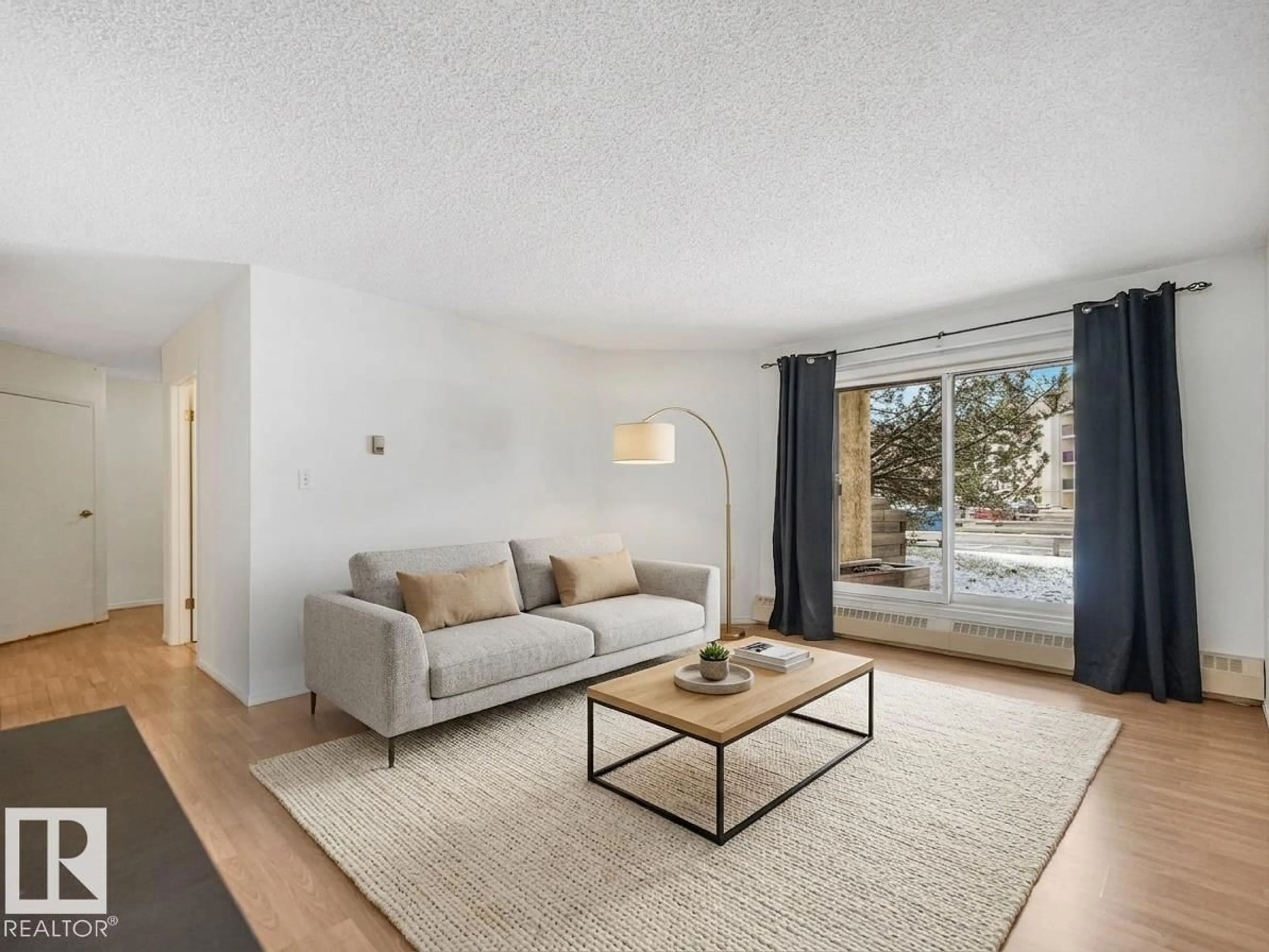 Living room with furniture, unknown for 143 10636 120 ST NW, Edmonton Alberta T5H4L5
