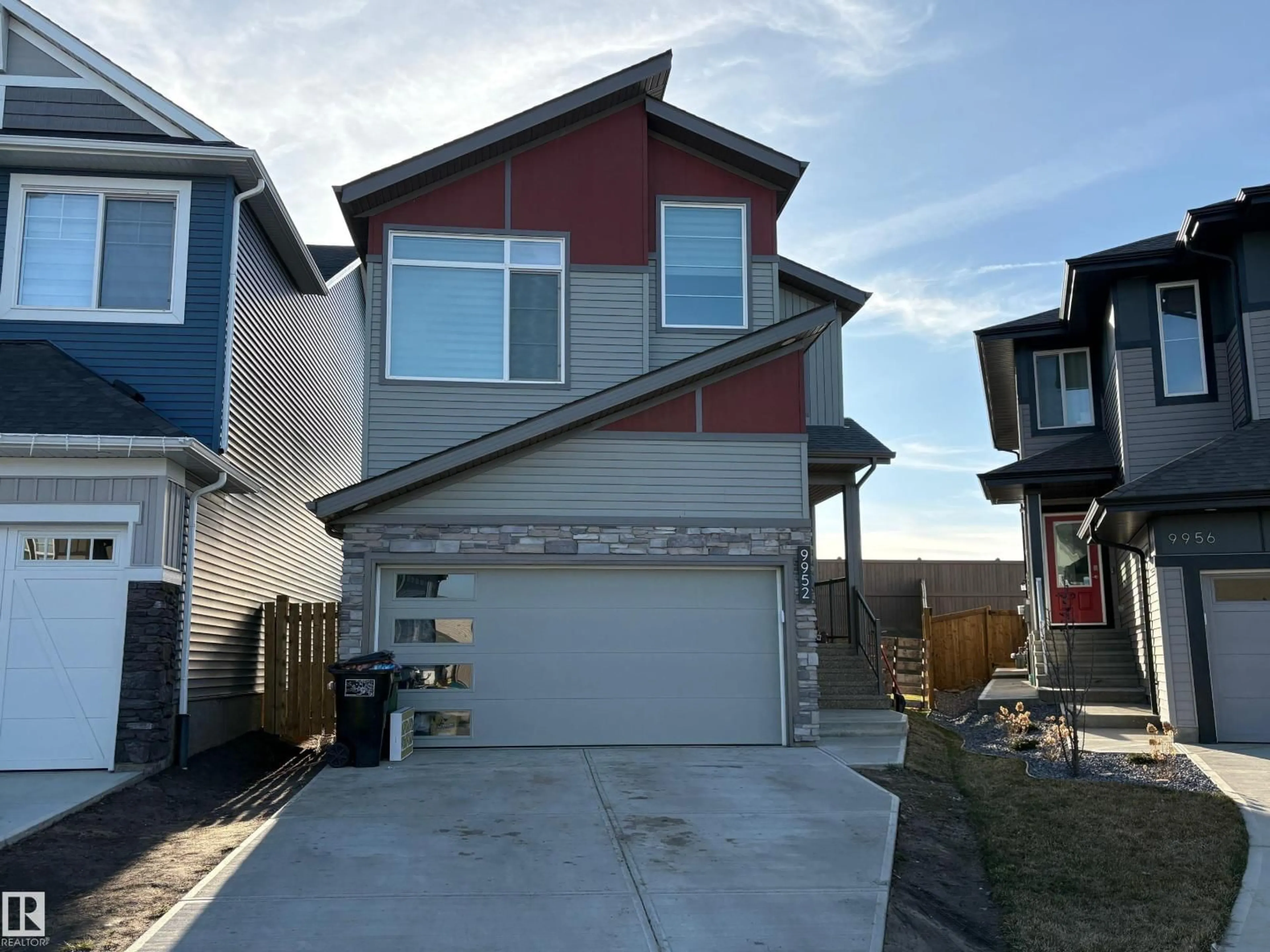Home with vinyl exterior material, street for 9952 227 ST, Edmonton Alberta T5T7V1