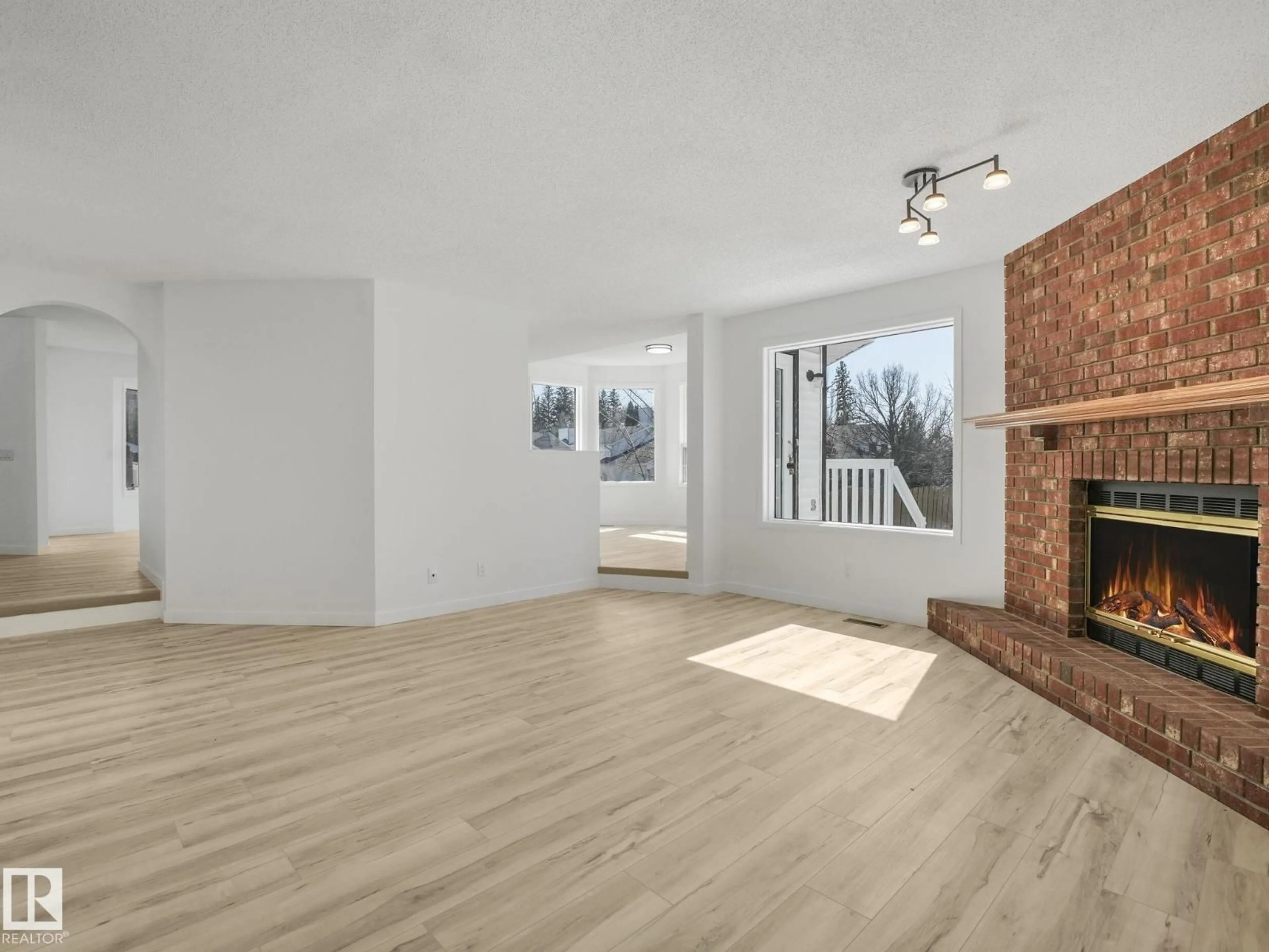 Living room with furniture, wood/laminate floor for 4103 28 AV, Edmonton Alberta T6L4H2