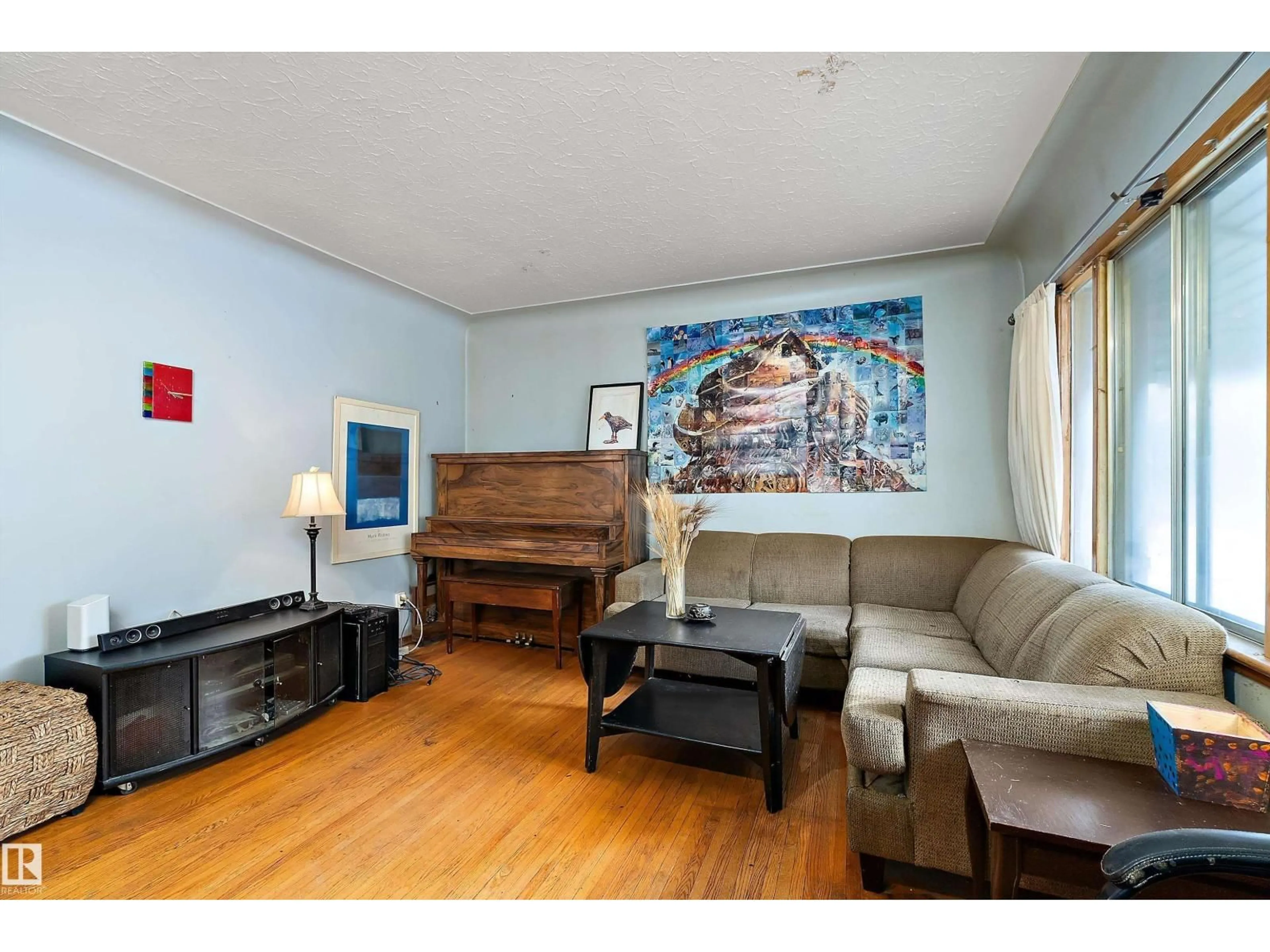 Living room with furniture, wood/laminate floor for NW - 10124 88 AV, Edmonton Alberta T6E2R9