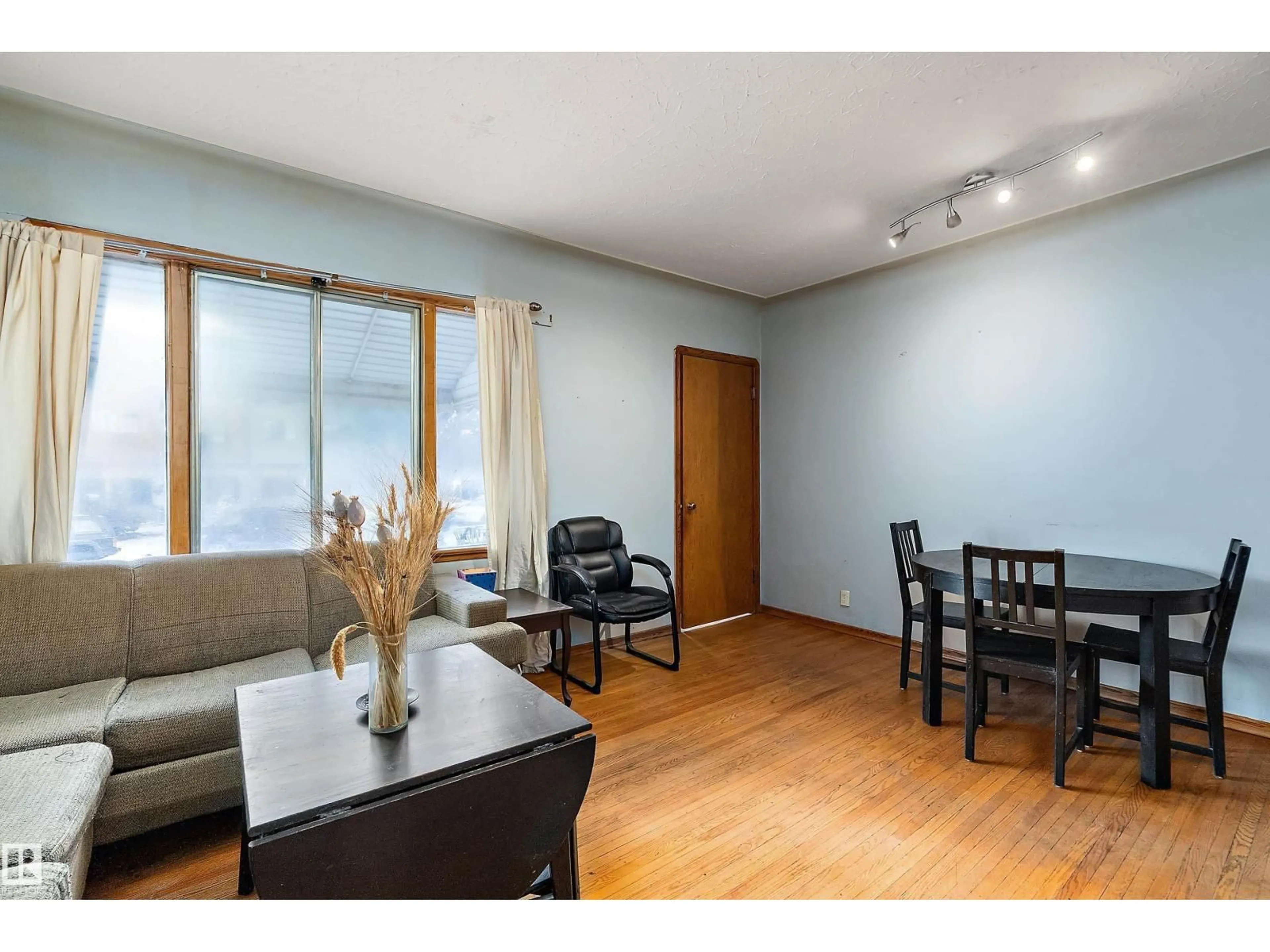 Living room with furniture, wood/laminate floor for NW - 10124 88 AV, Edmonton Alberta T6E2R9