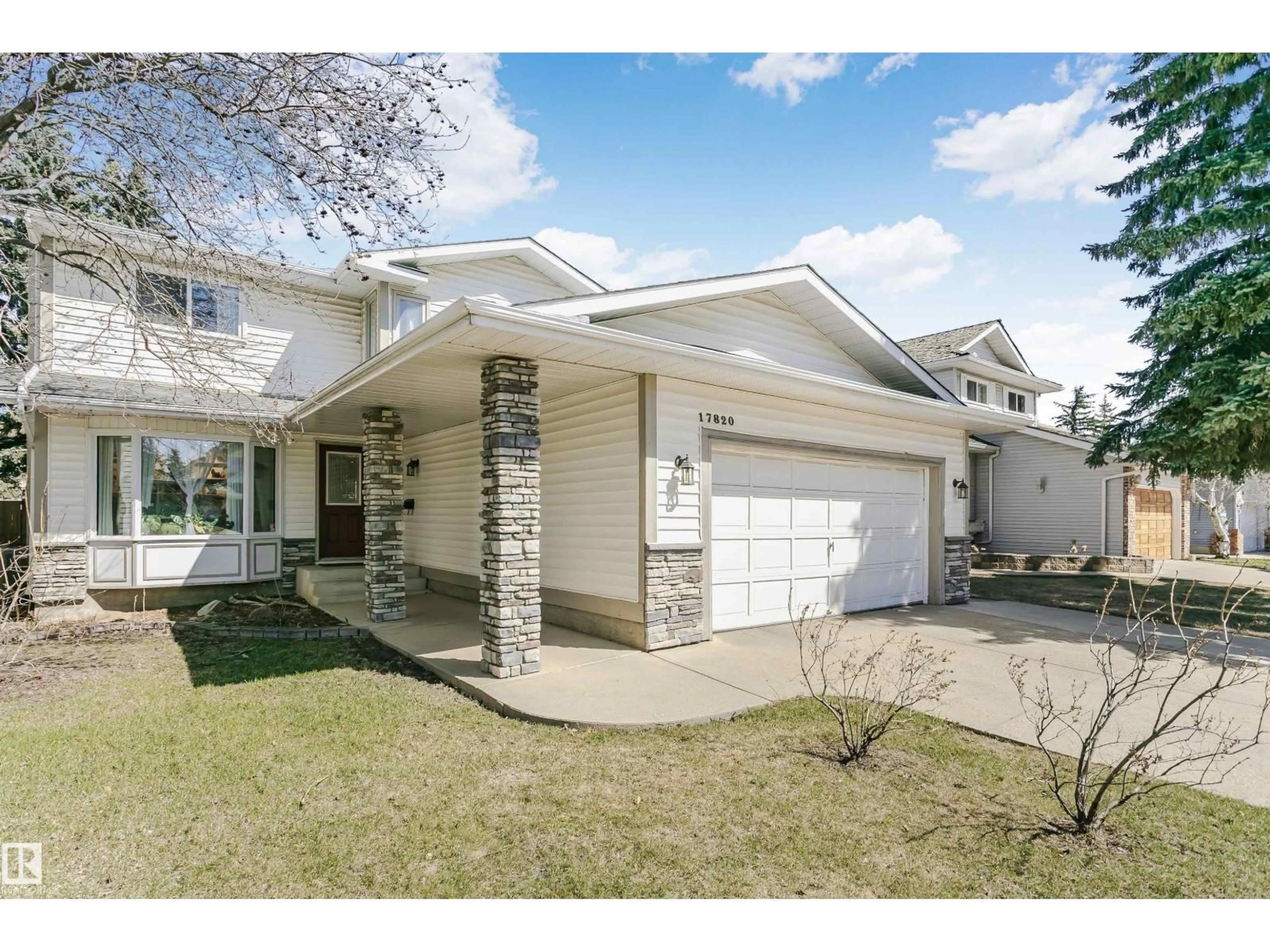 Home with vinyl exterior material, street for 17820 57 AV, Edmonton Alberta T6M1S5