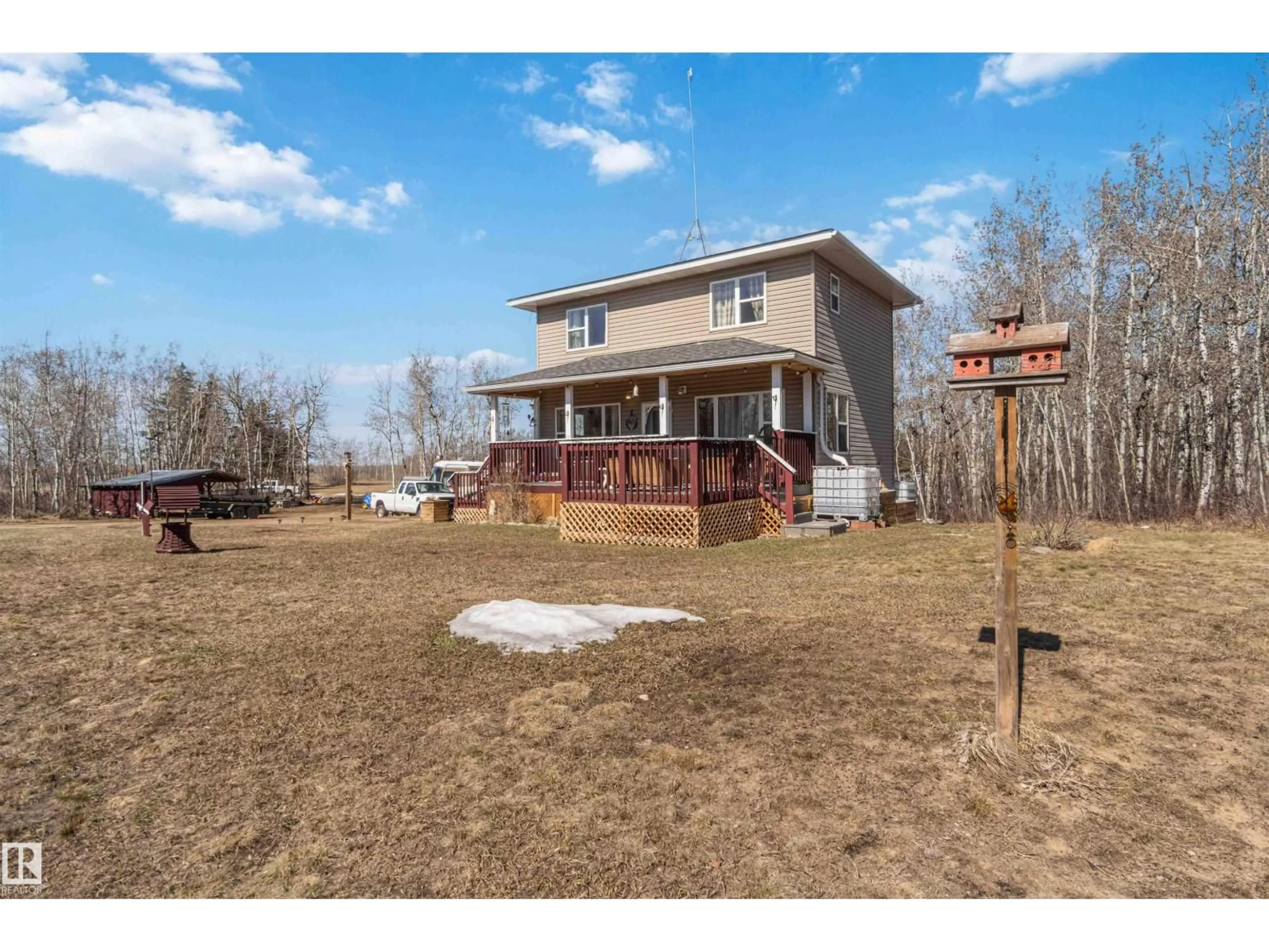 A pic from outside/outdoor area/front of a property/back of a property/a pic from drone, water/lake/river/ocean view for 15 22515 TWP RD 575A, Rural Sturgeon County Alberta T0A1N6