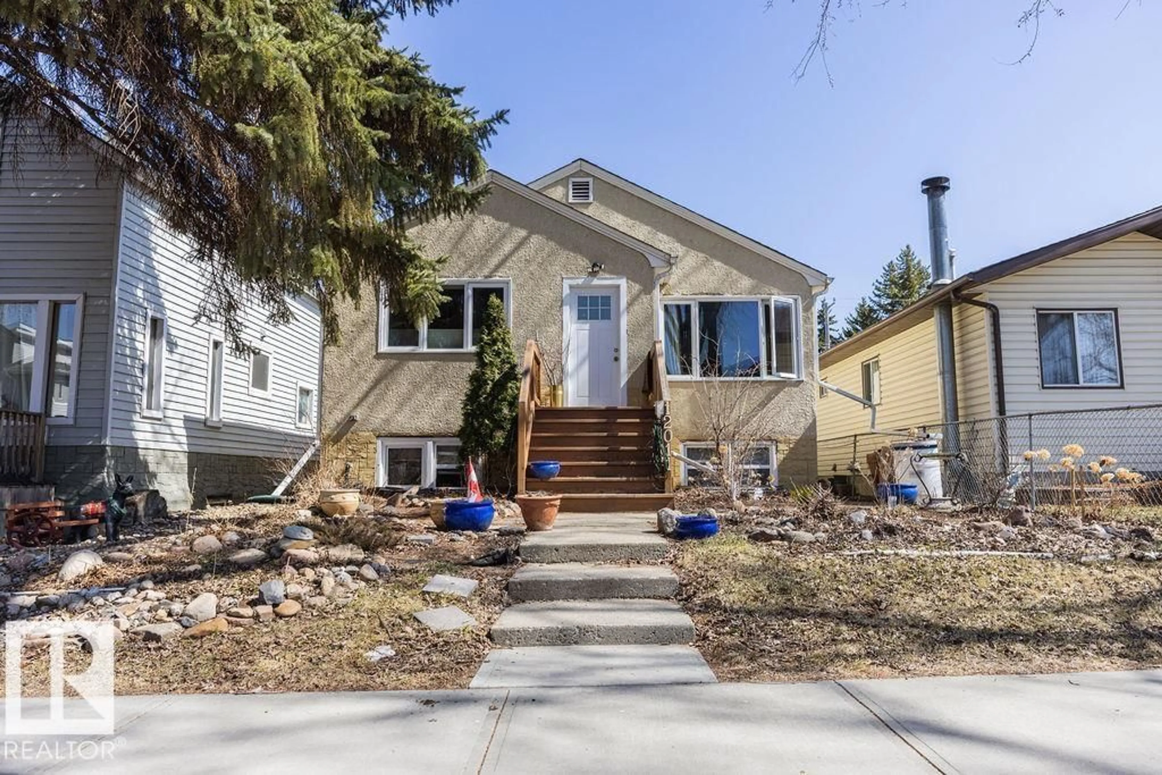 Home with vinyl exterior material, street for NE NW - 12011 62 ST, Edmonton Alberta T5W4C9