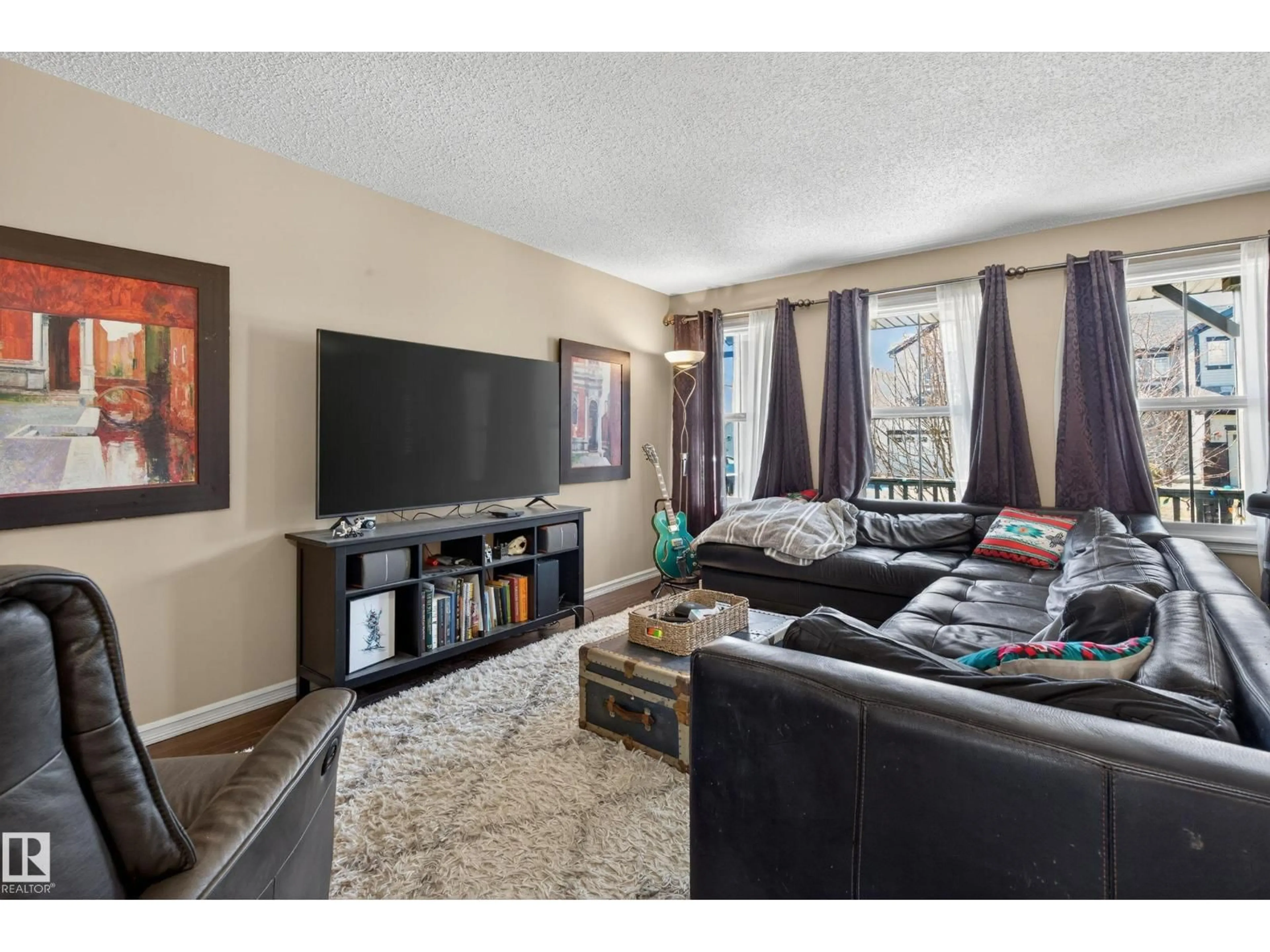 Living room with furniture, unknown for 5636 18 AV, Edmonton Alberta T6X1P8