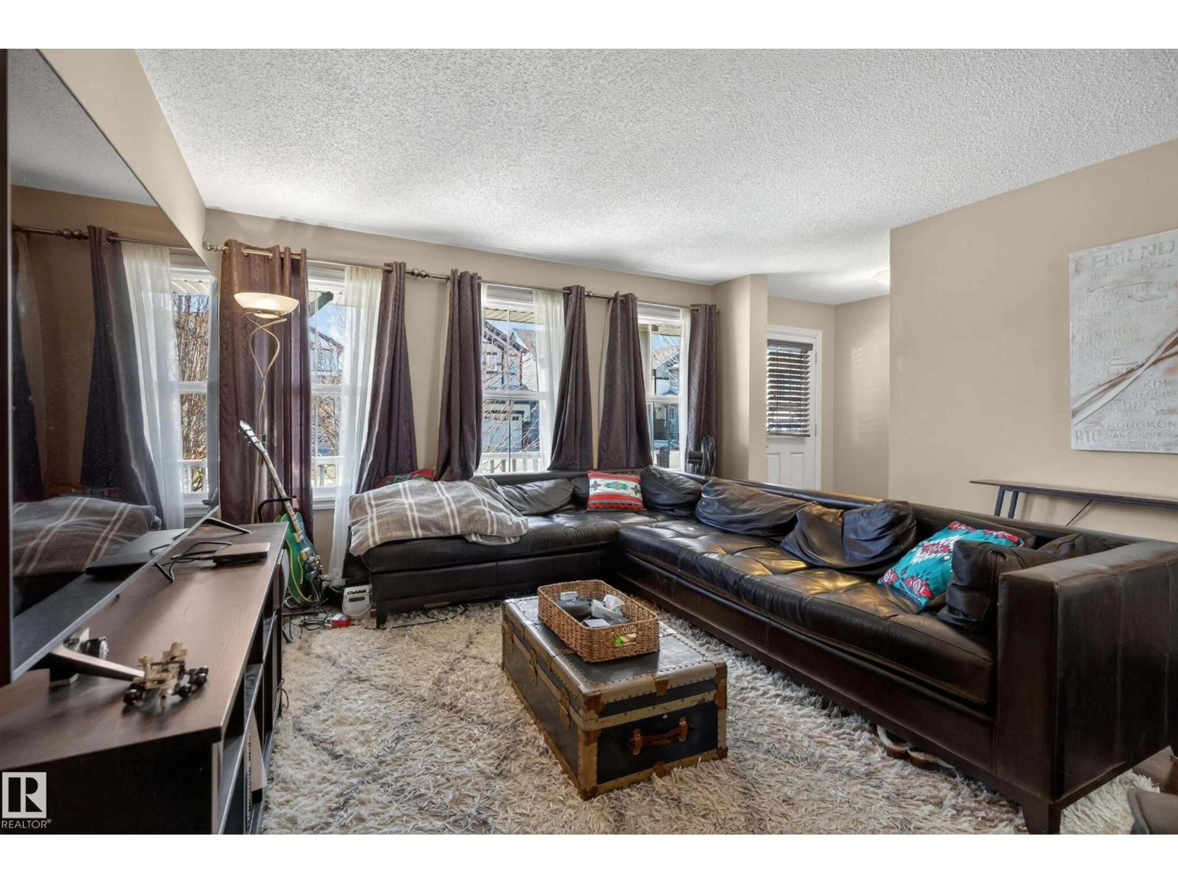 Living room with furniture, unknown for 5636 18 AV, Edmonton Alberta T6X1P8
