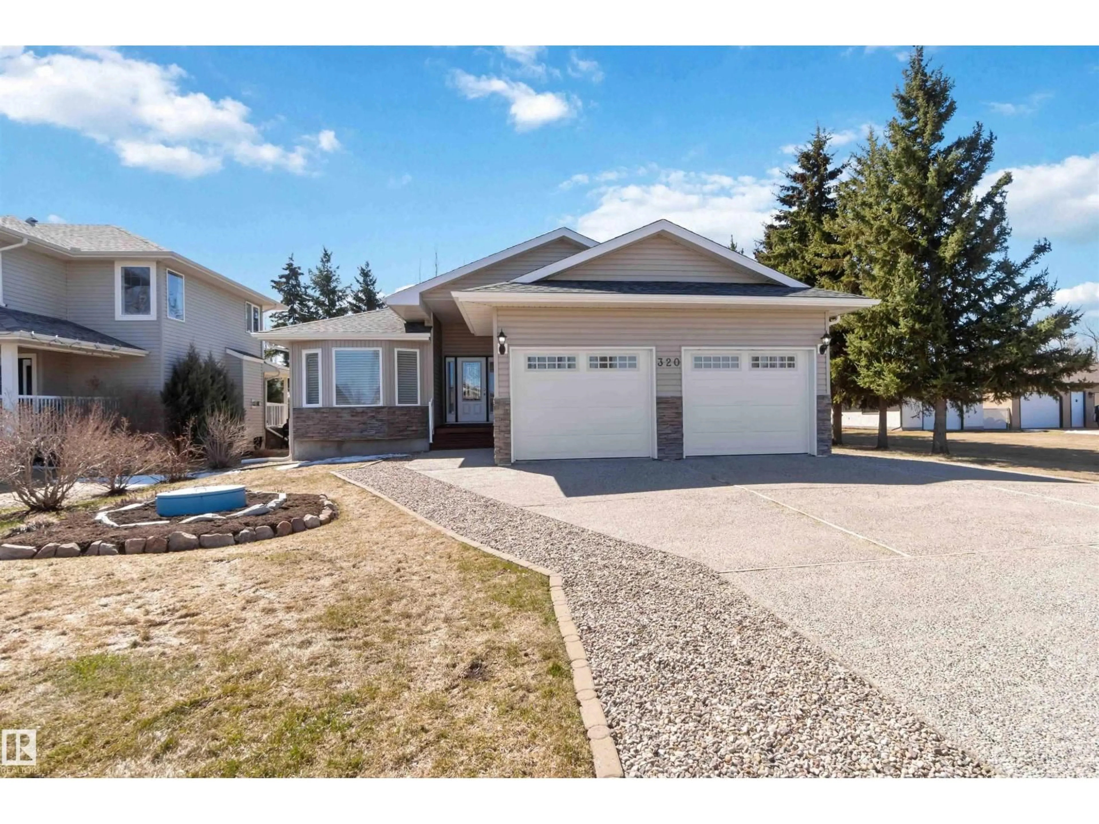 Home with vinyl exterior material, street for 320 ST. JOHN ST, Cardiff Alberta T8R2G5