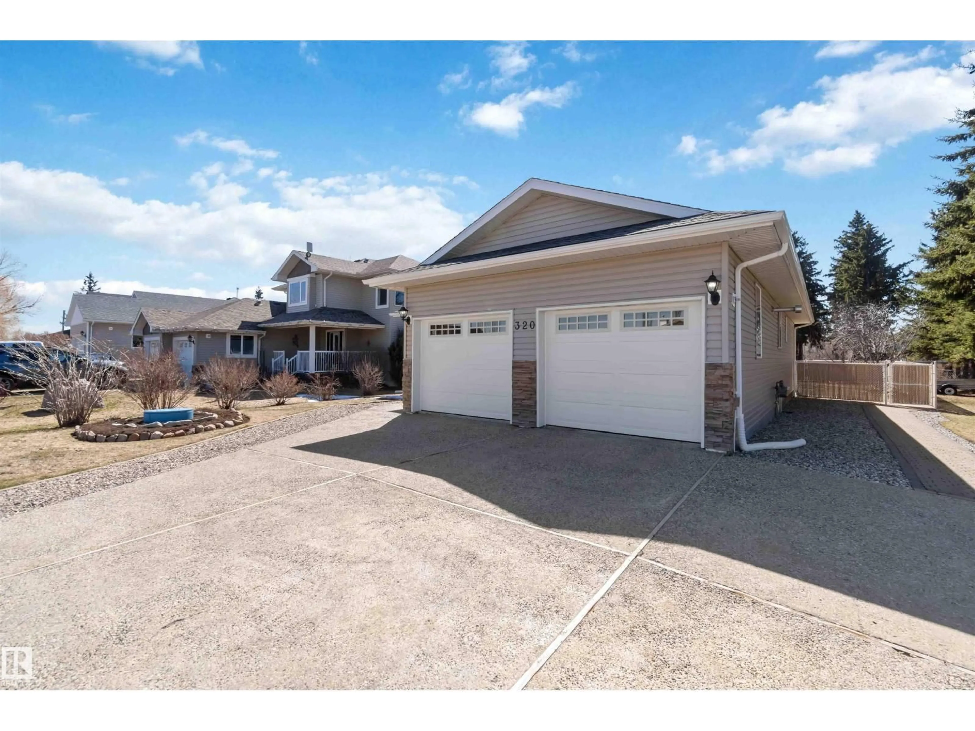 Home with vinyl exterior material, street for 320 ST. JOHN ST, Cardiff Alberta T8R2G5