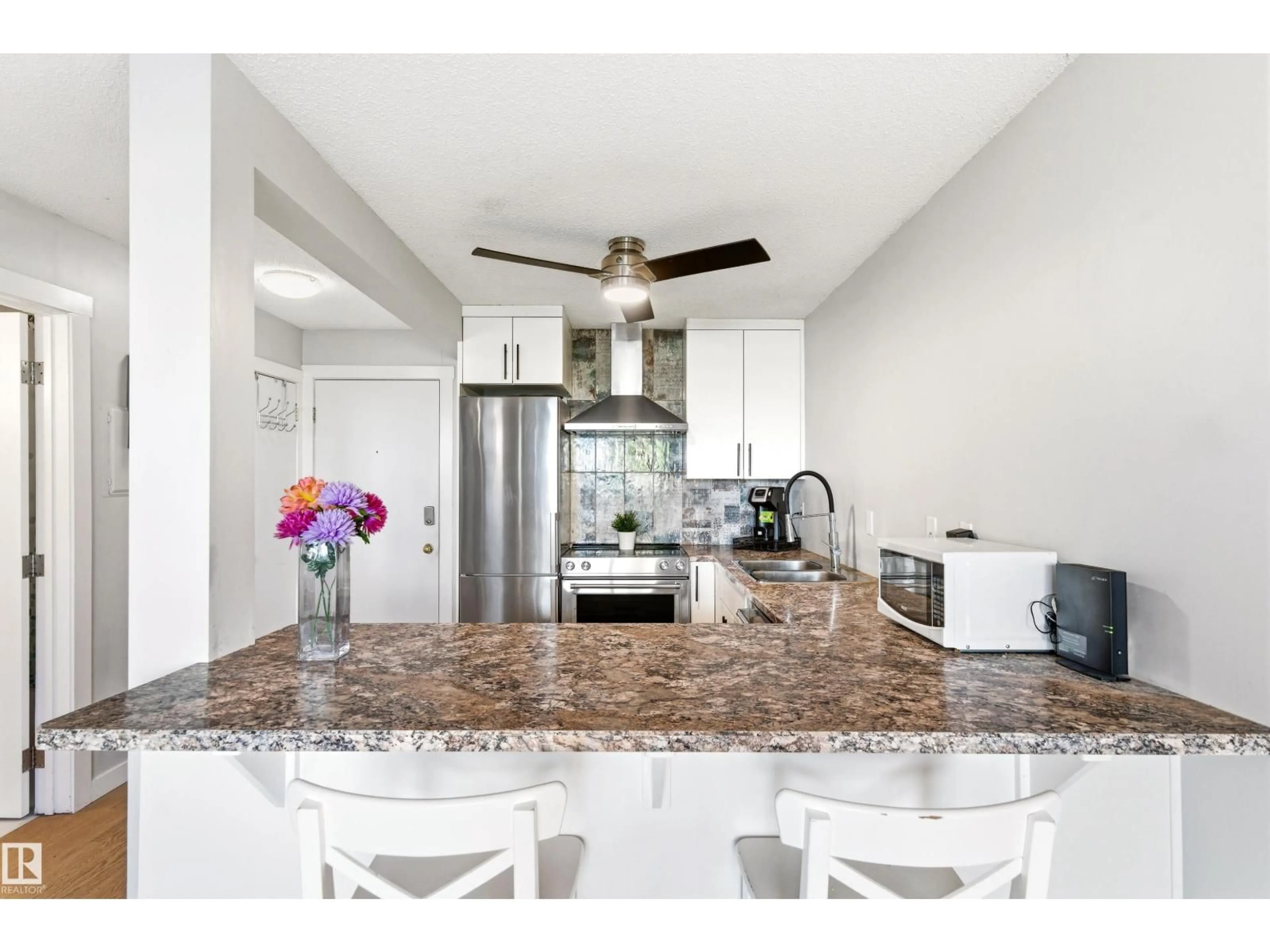 Open concept kitchen, ceramic/tile floor for #105 - 10230 120 STREET, Edmonton Alberta T5K2A3