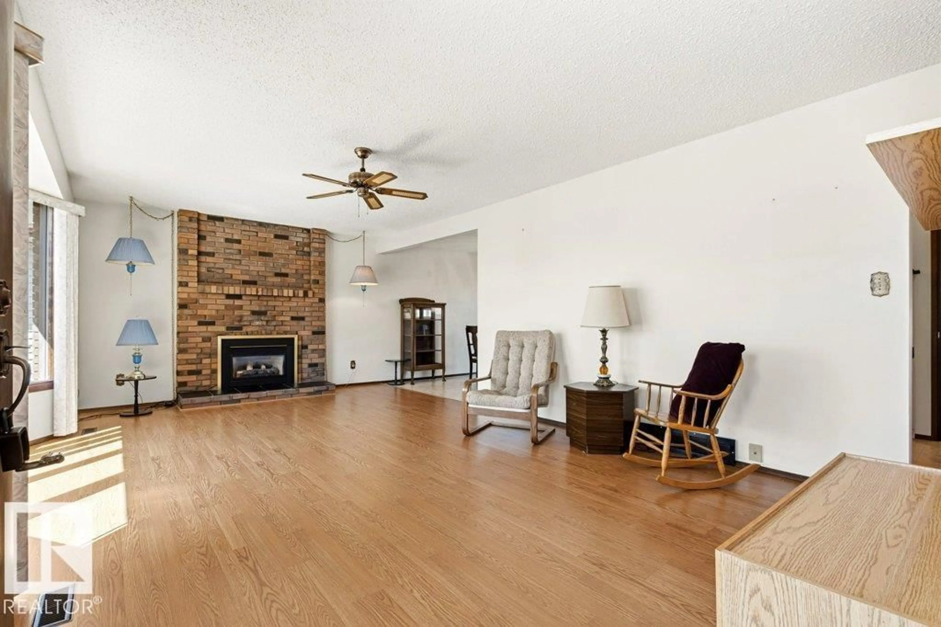 Living room with furniture, wood/laminate floor for 35 OATWAY DR, Stony Plain Alberta T7Z1G5