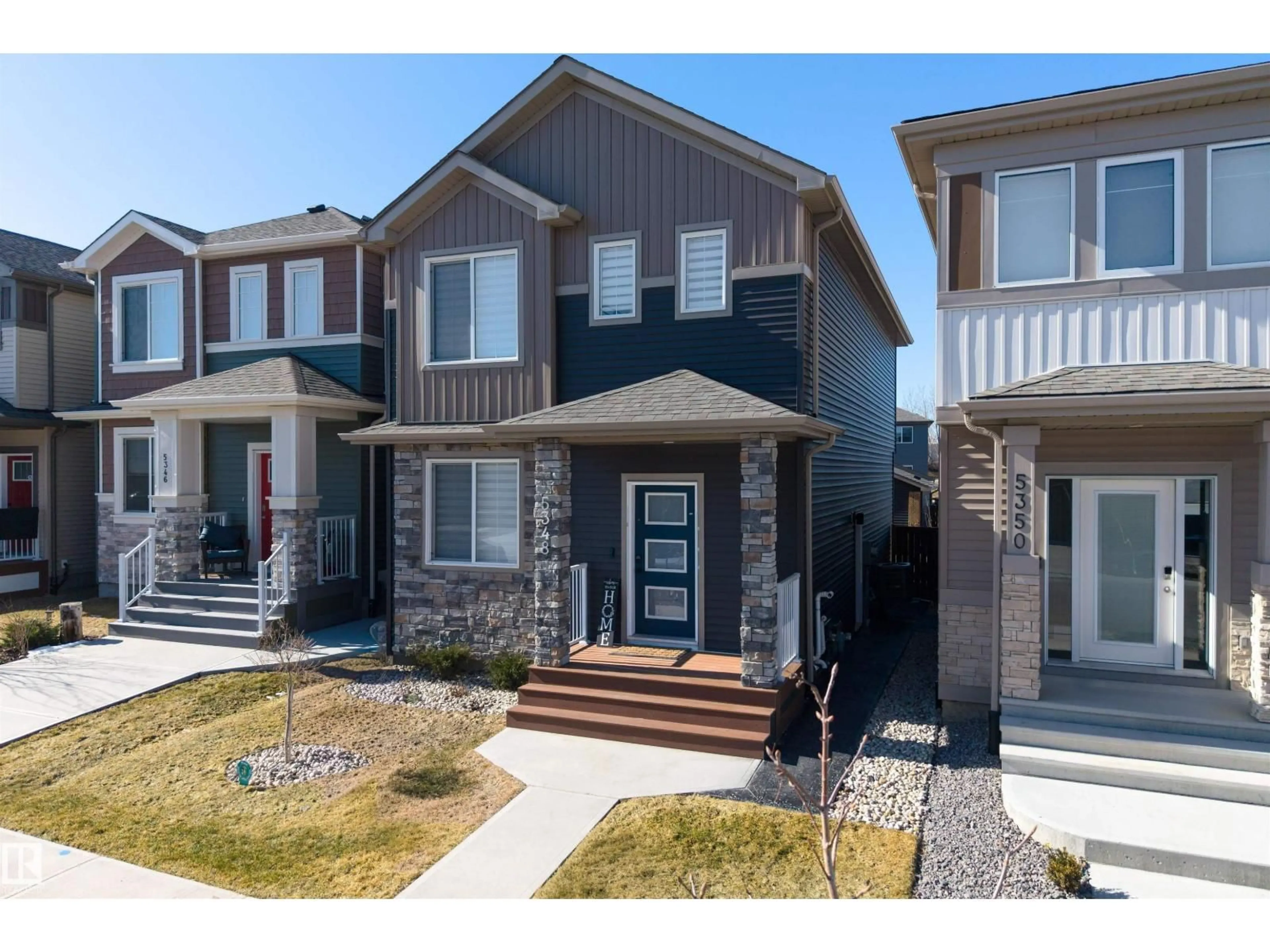 Home with vinyl exterior material, street for 5348 LARK LD, Edmonton Alberta T5S0S2
