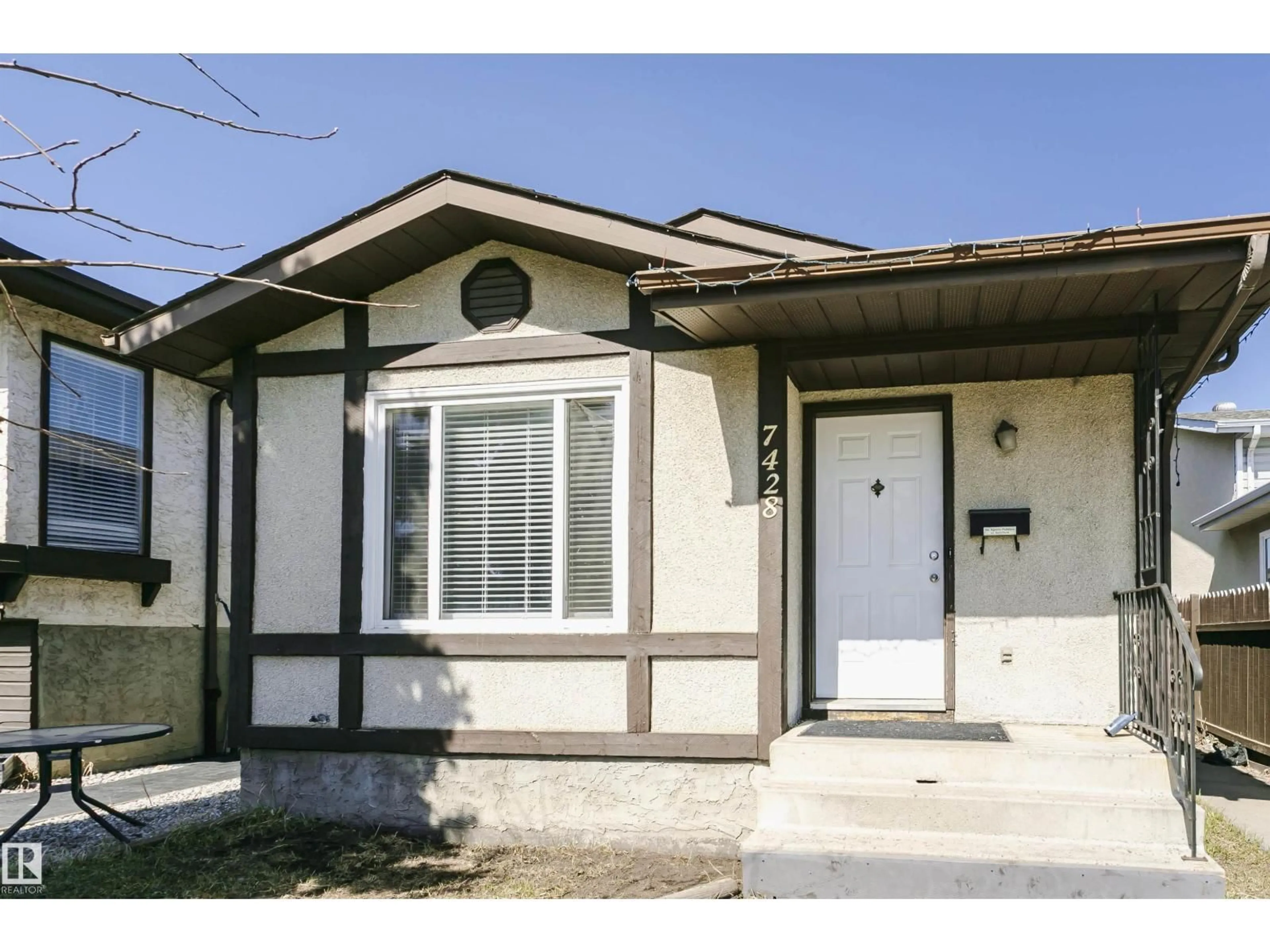 Home with vinyl exterior material, street for 7428 188 ST, Edmonton Alberta T5T5J5