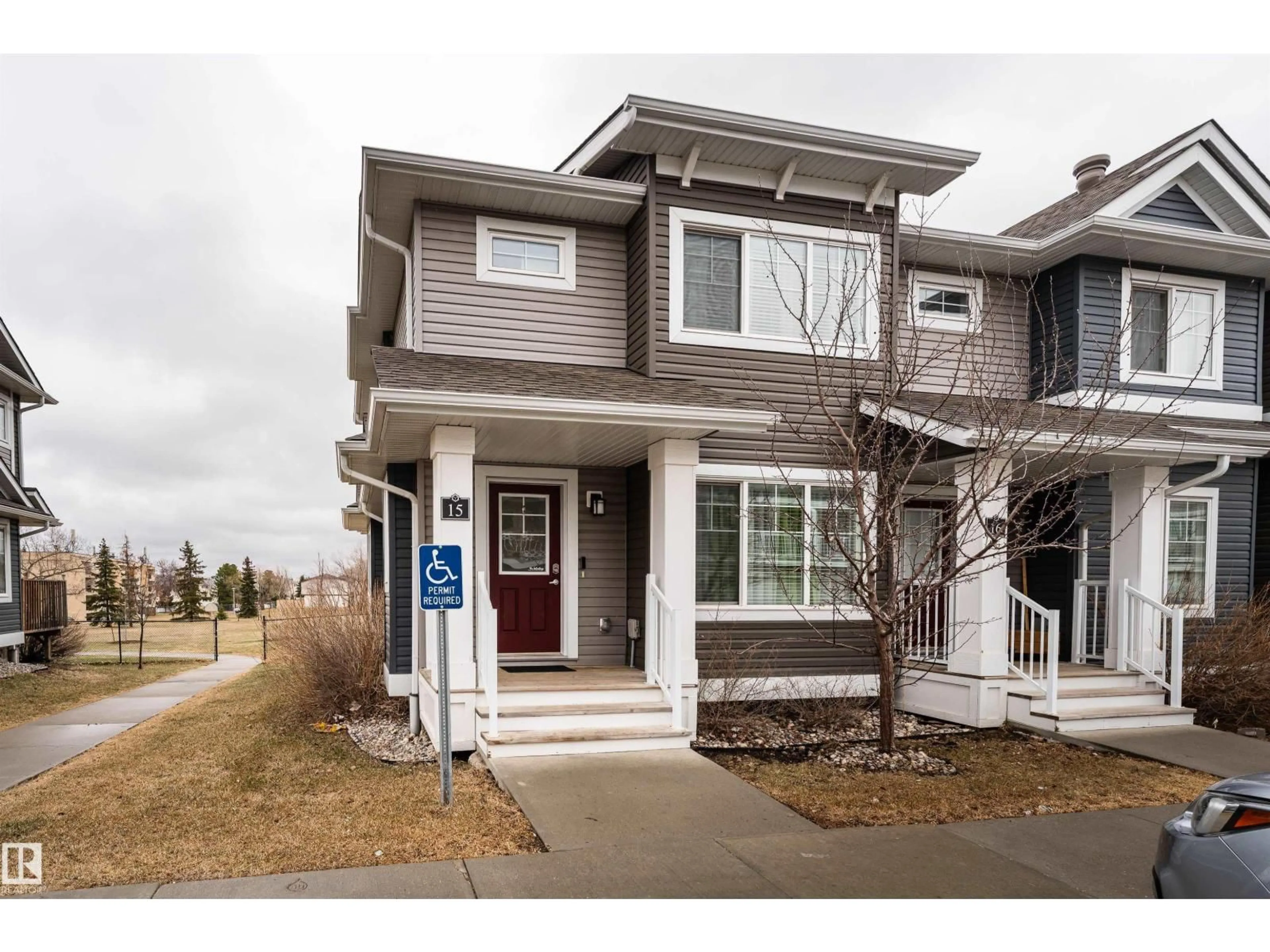 Home with vinyl exterior material, street for 15 - 5203 149 AV, Edmonton Alberta T5A1B5