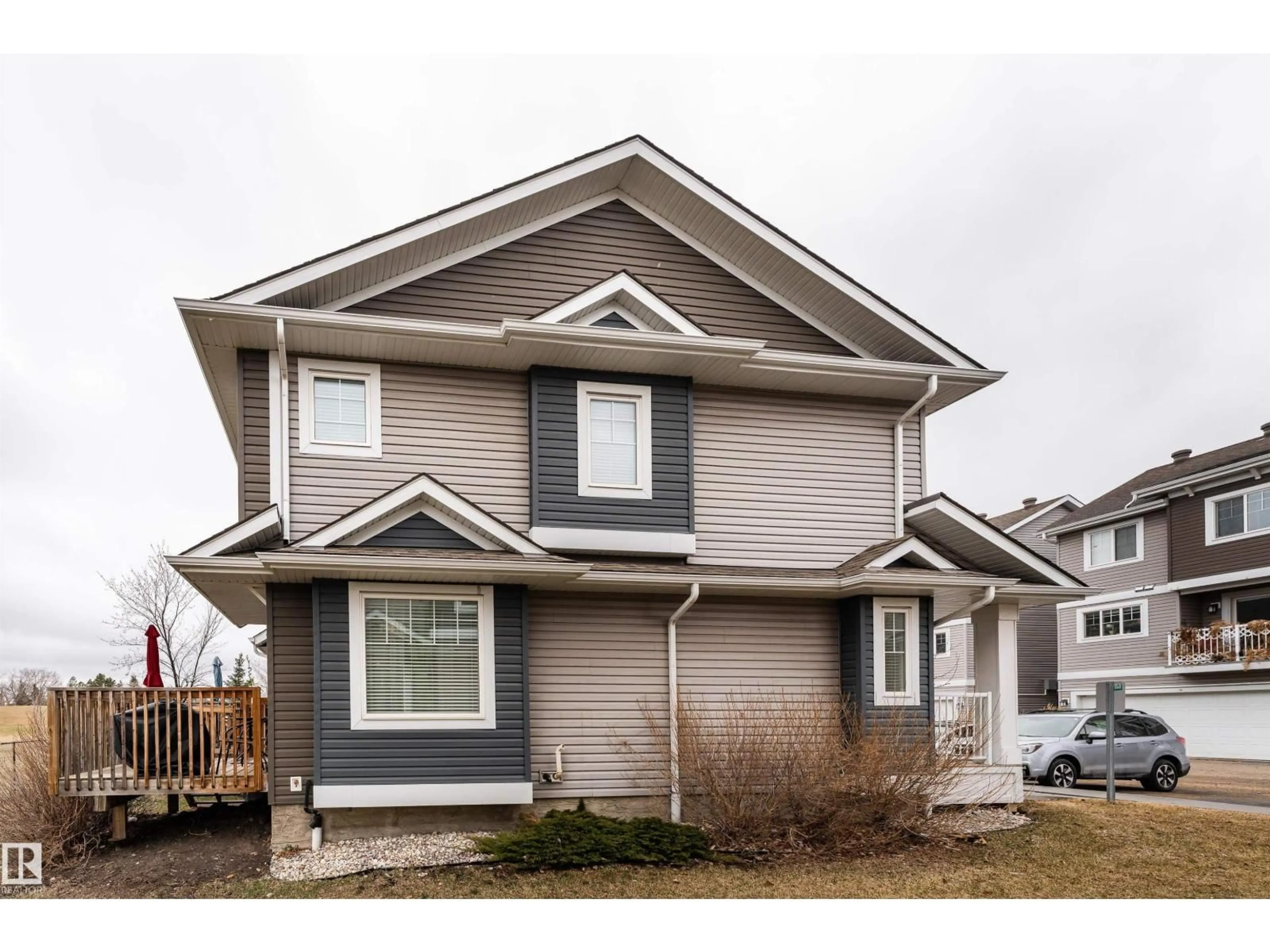 Home with vinyl exterior material, street for 15 - 5203 149 AV, Edmonton Alberta T5A1B5
