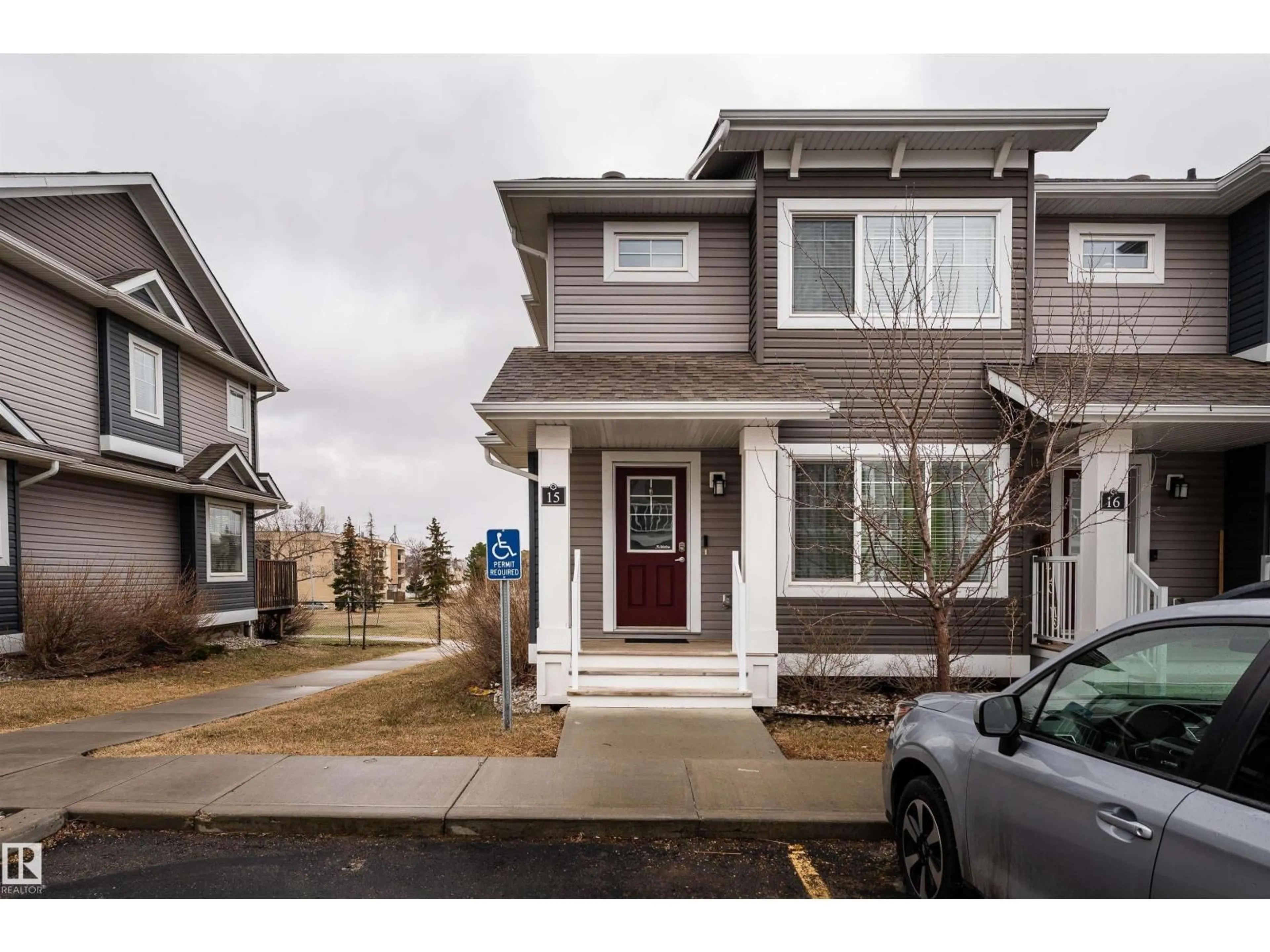Home with vinyl exterior material, street for 15 - 5203 149 AV, Edmonton Alberta T5A1B5