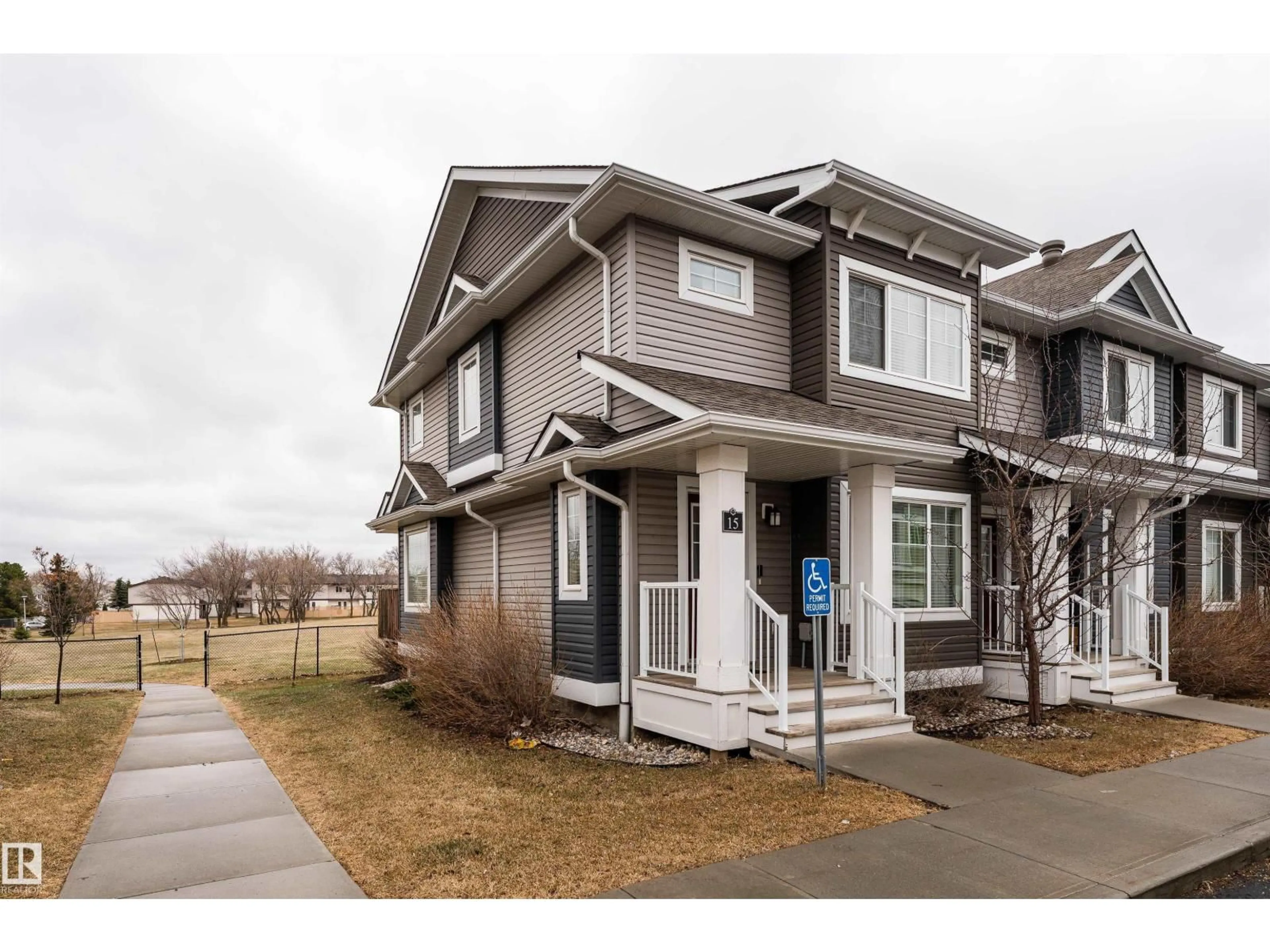 Home with vinyl exterior material, street for 15 - 5203 149 AV, Edmonton Alberta T5A1B5