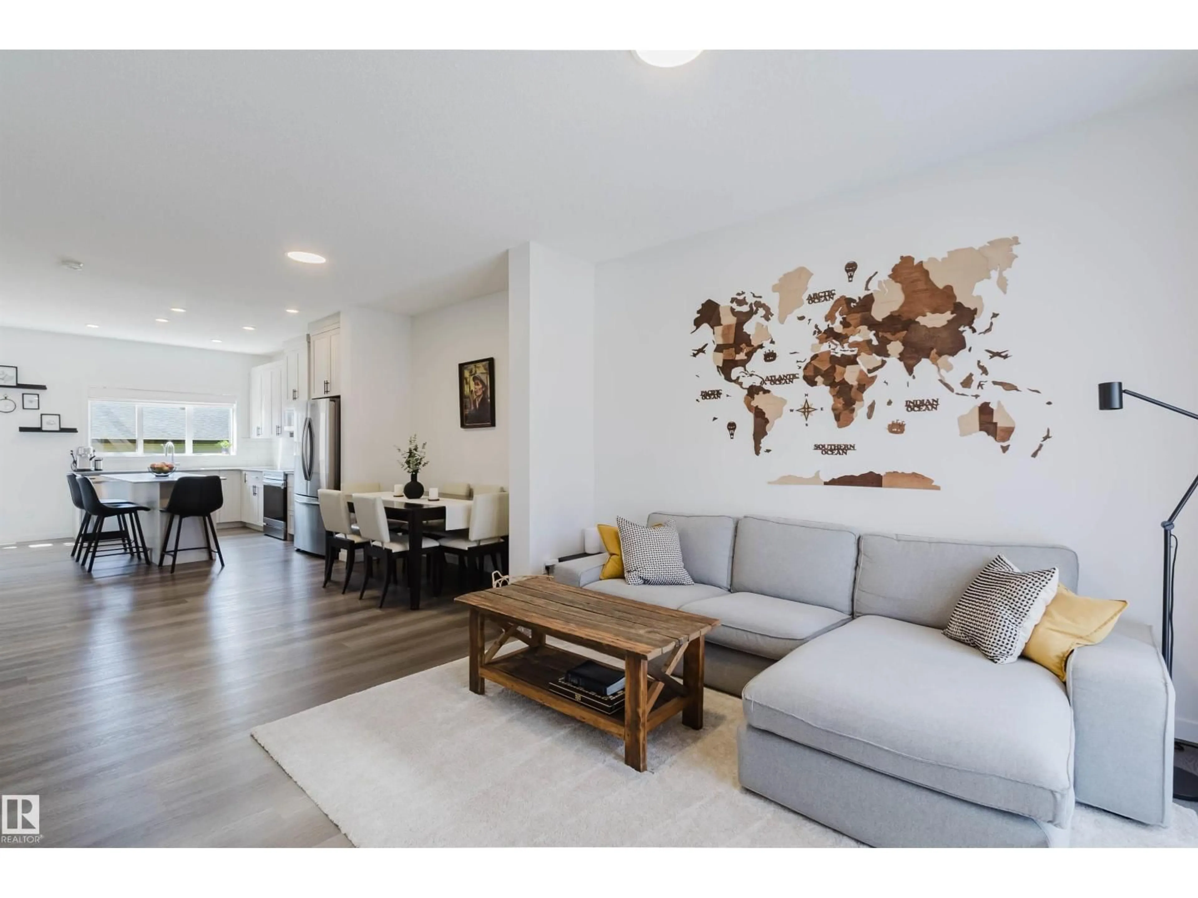 Living room with furniture, wood/laminate floor for 5237 EDGEMONT BV, Edmonton Alberta T6M1J9