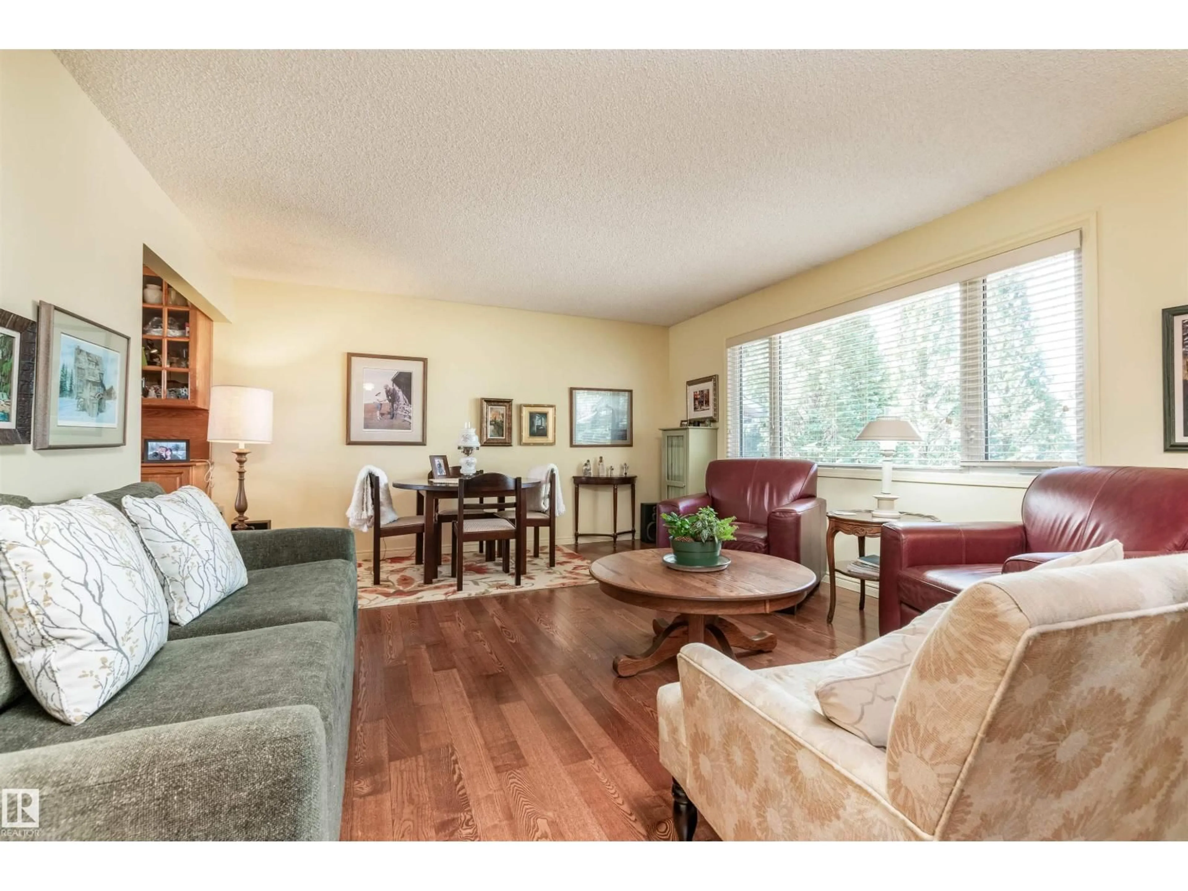 Living room with furniture, wood/laminate floor for 108 MARION PL, Sherwood Park Alberta T8A0P3