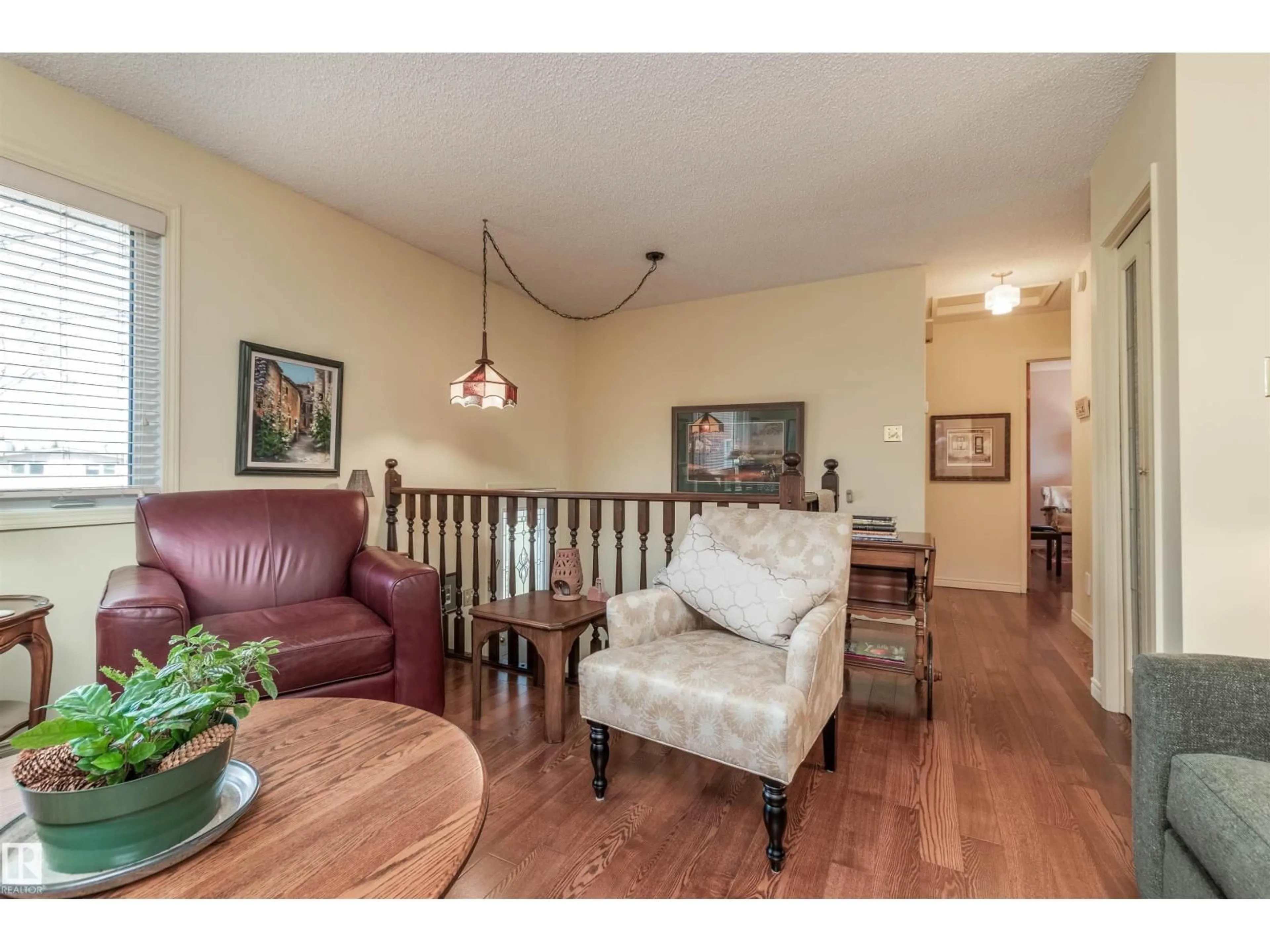 Living room with furniture, wood/laminate floor for 108 MARION PL, Sherwood Park Alberta T8A0P3