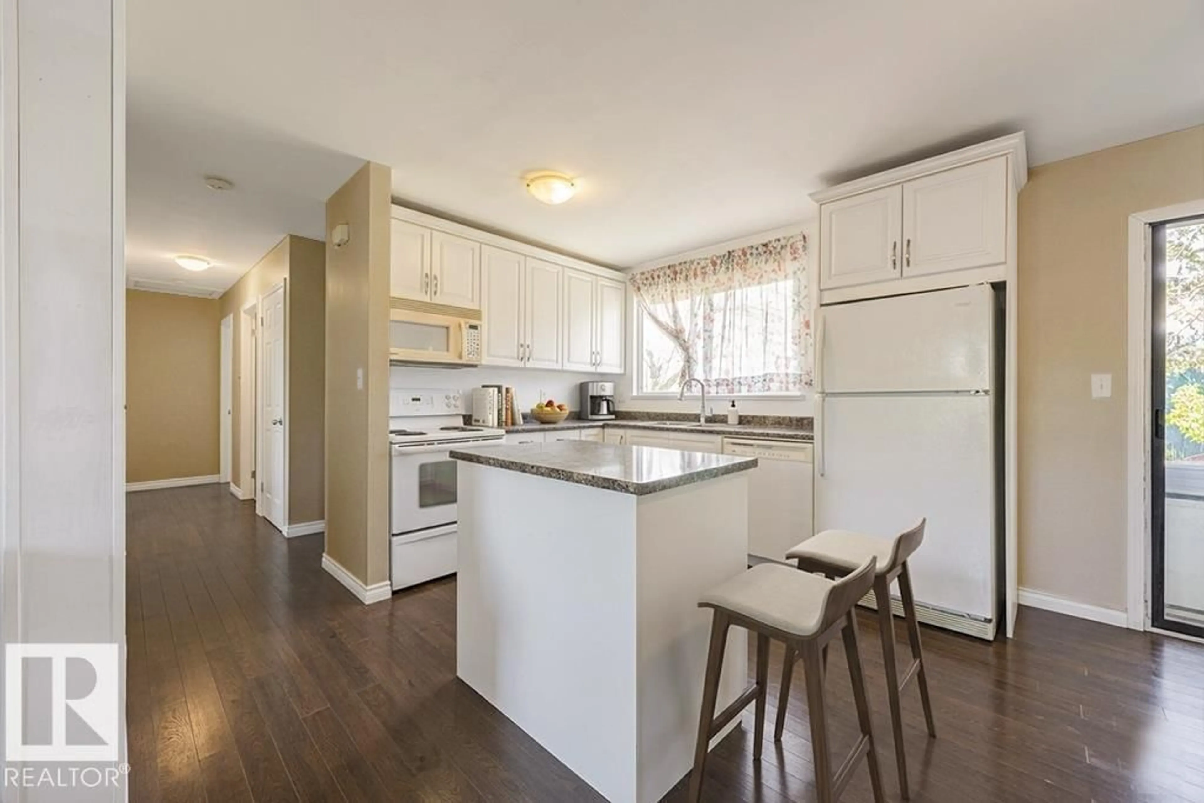 Open concept kitchen, wood/laminate floor for NW - 9827 152 ST, Edmonton Alberta T5P1X2