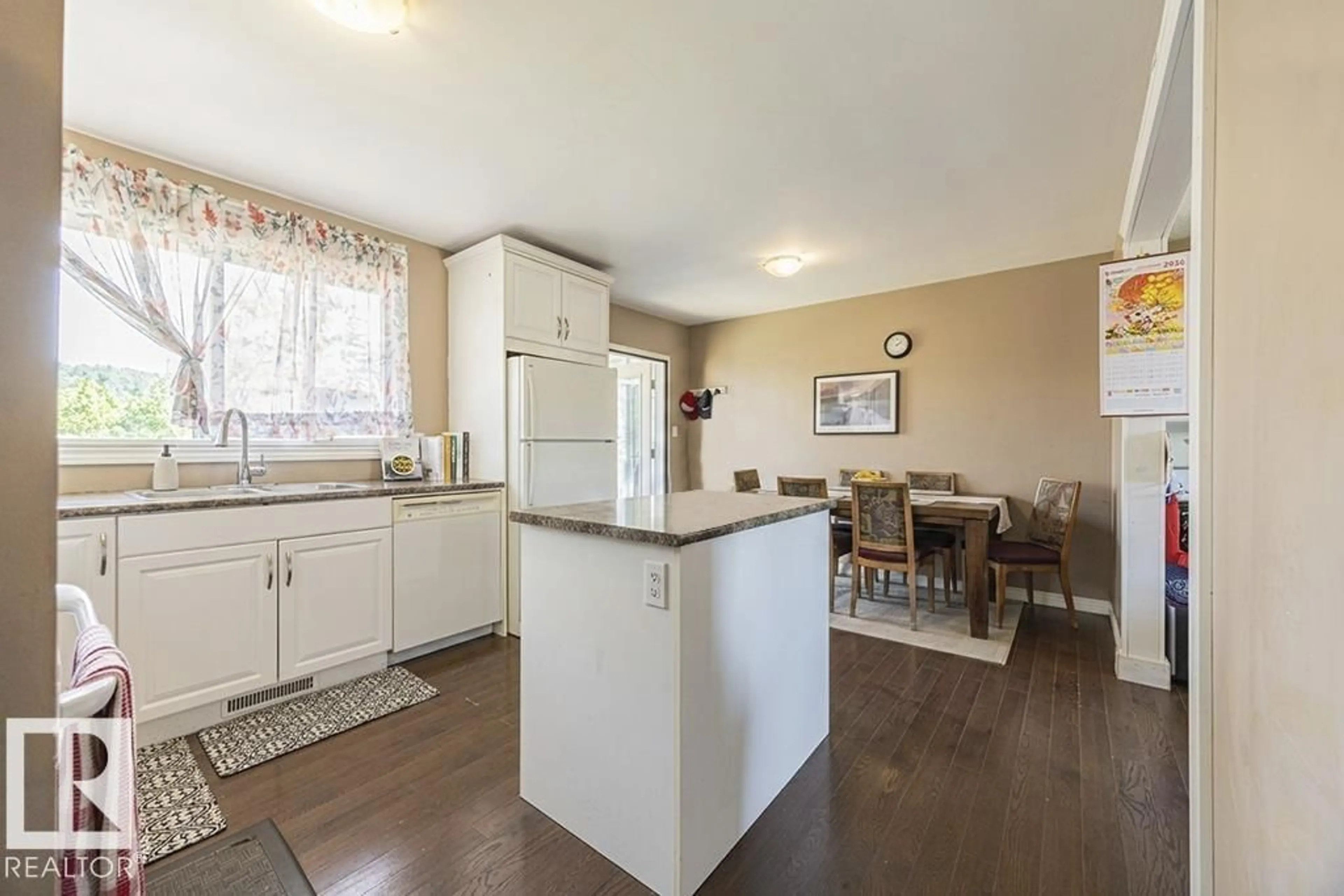Open concept kitchen, wood/laminate floor for NW - 9827 152 ST, Edmonton Alberta T5P1X2