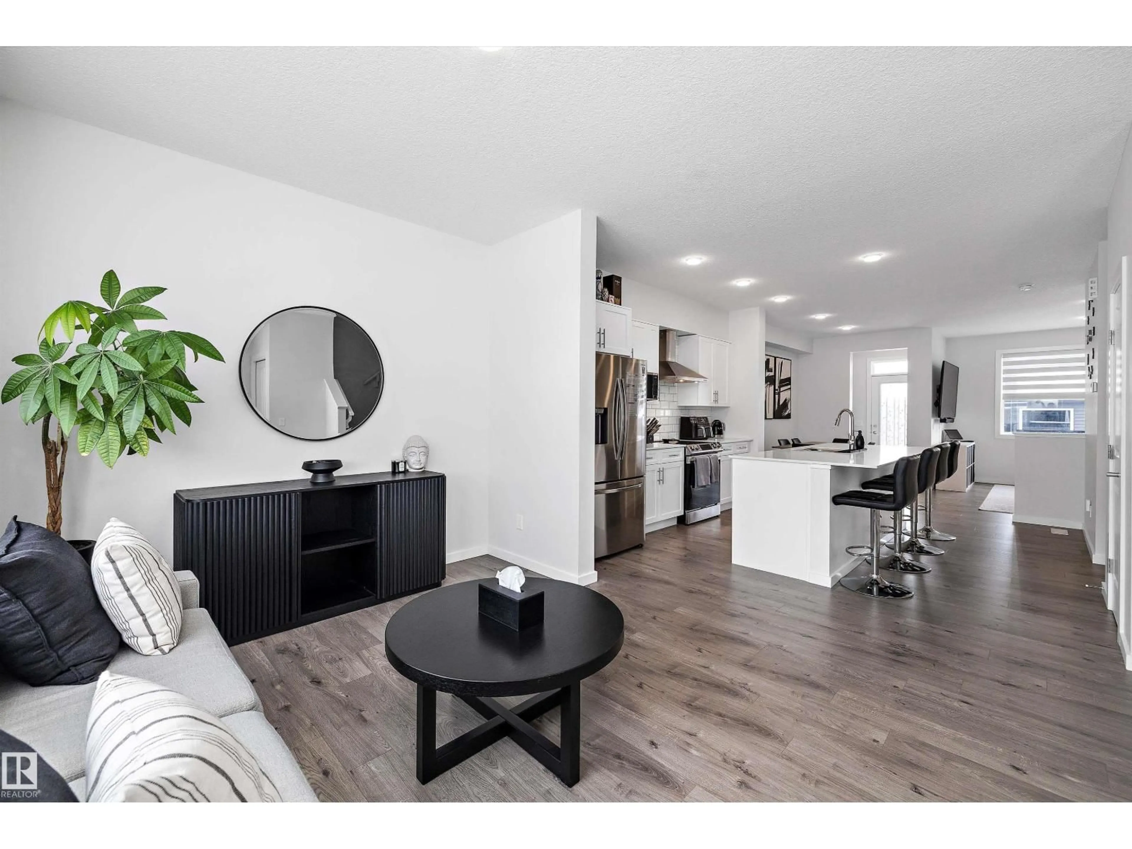 Open concept kitchen, wood/laminate floor for 22539 81 AV, Edmonton Alberta T5T7K9