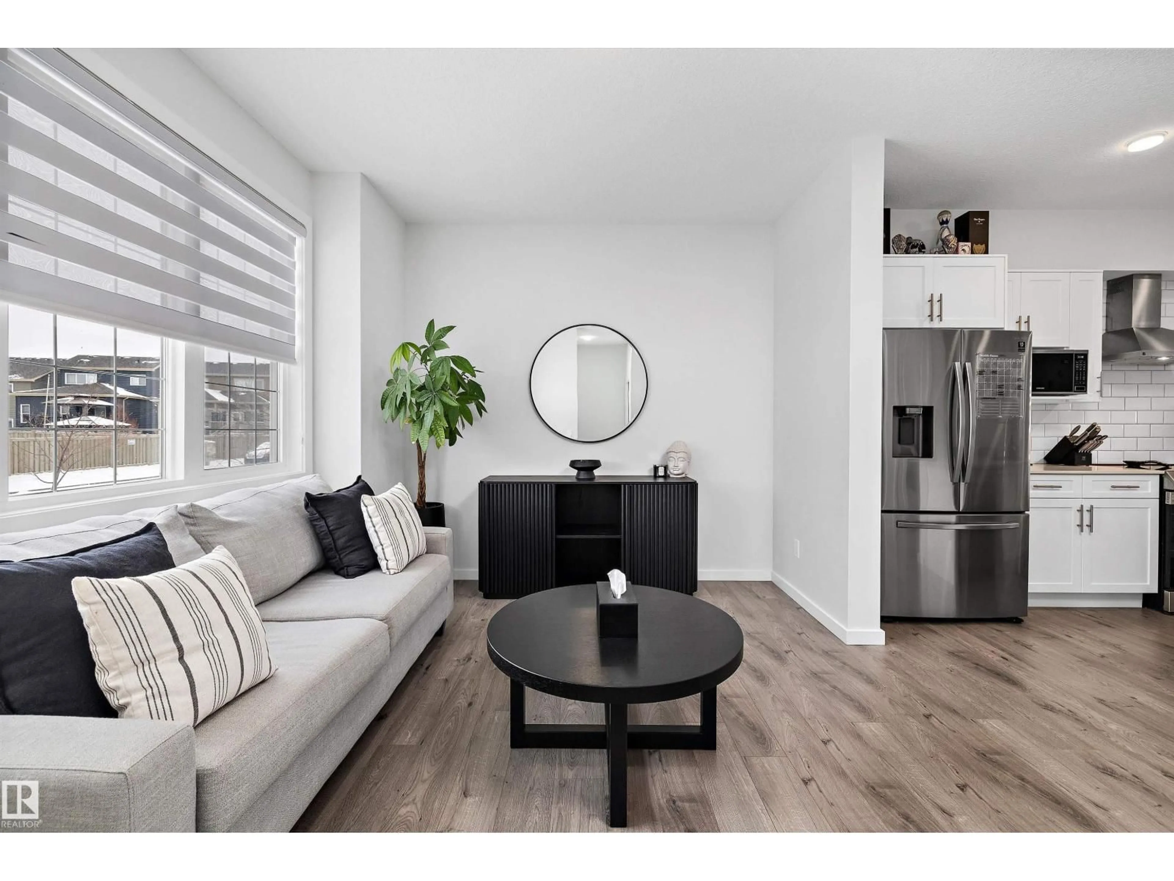 Living room with furniture, wood/laminate floor for 22539 81 AV, Edmonton Alberta T5T7K9