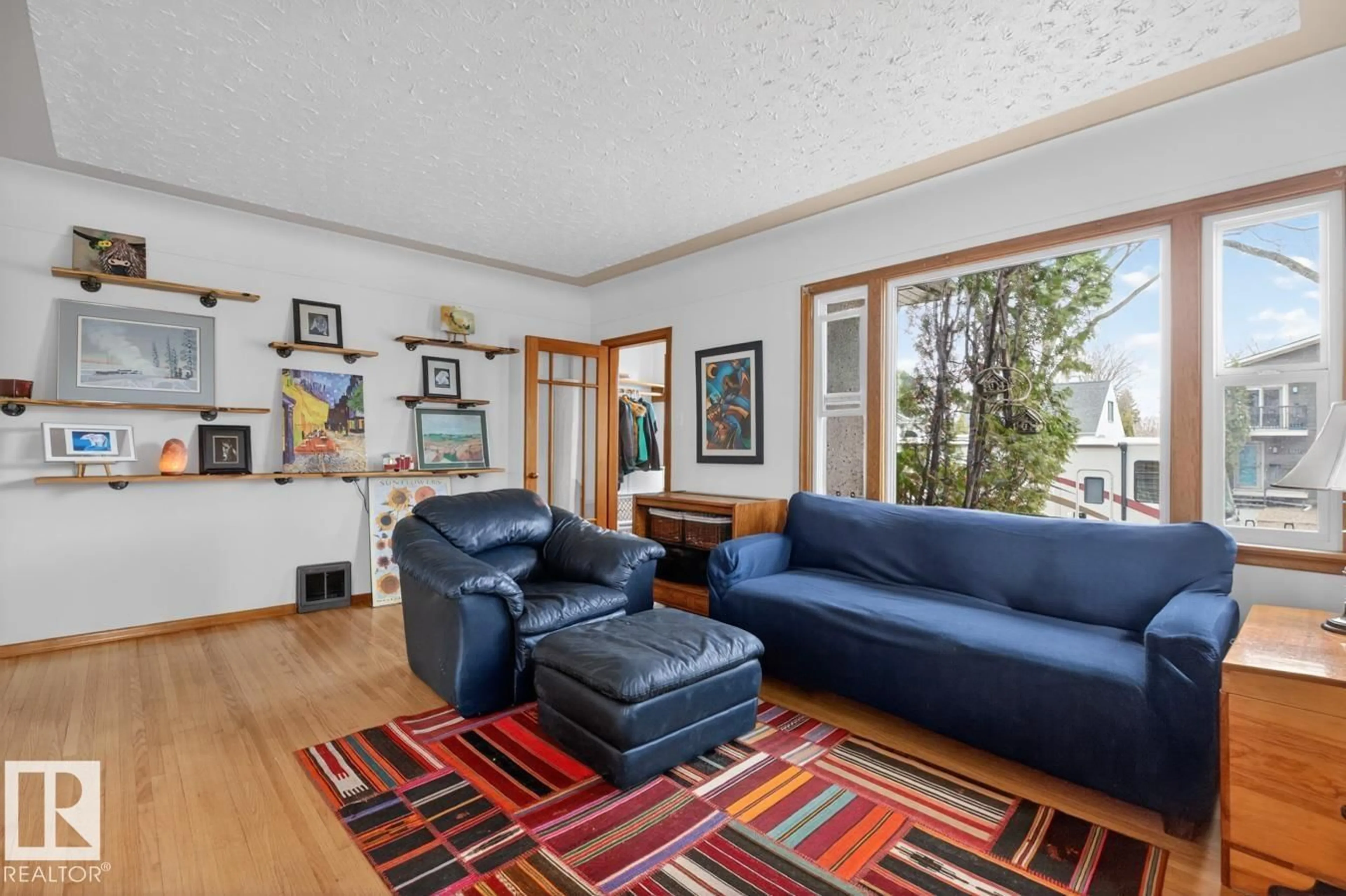 Living room with furniture, unknown for NW - 12130 60 ST, Edmonton Alberta T5W2E9
