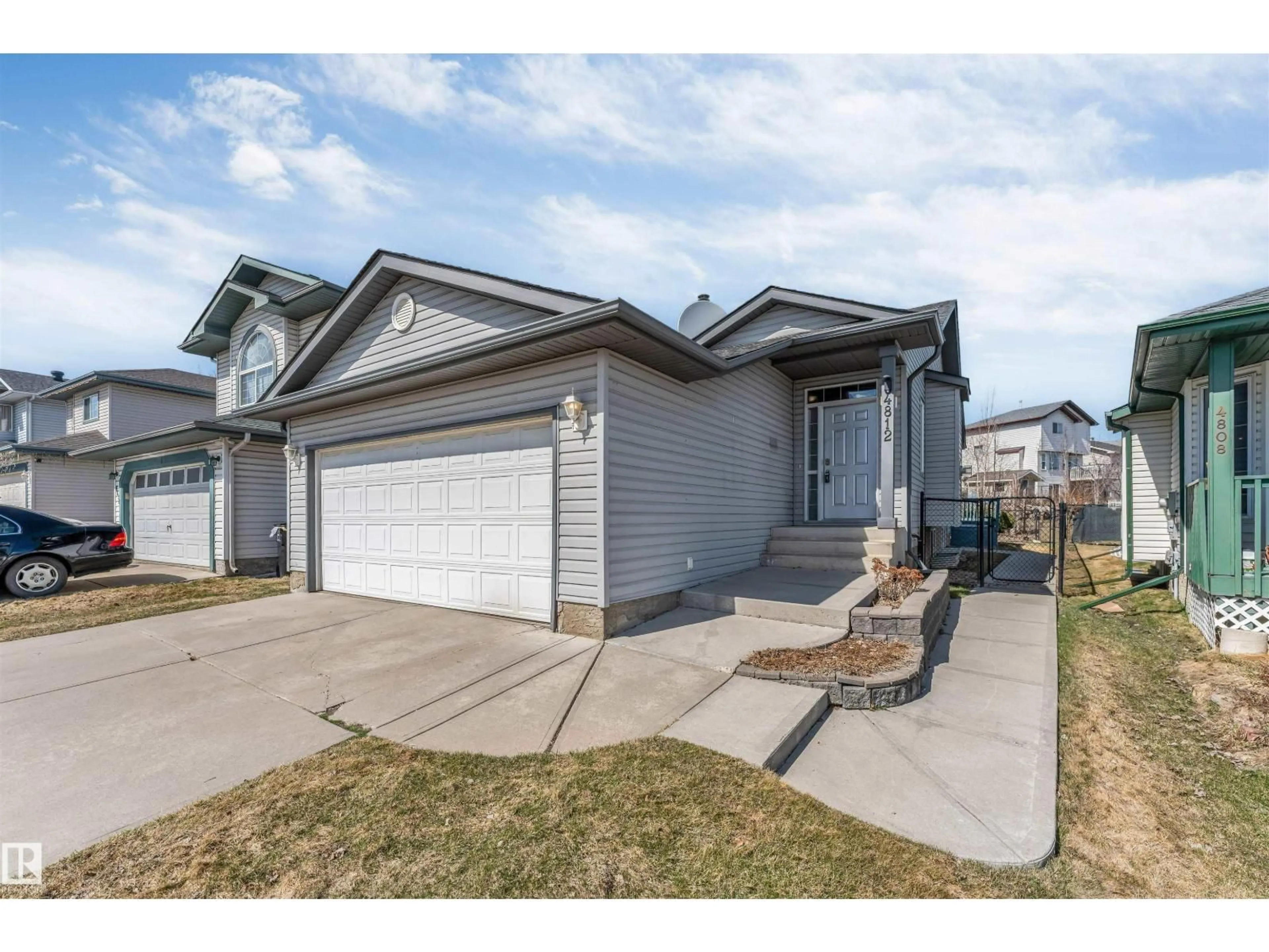 Home with vinyl exterior material, street for 4812 148 AV, Edmonton Alberta T5T2X1