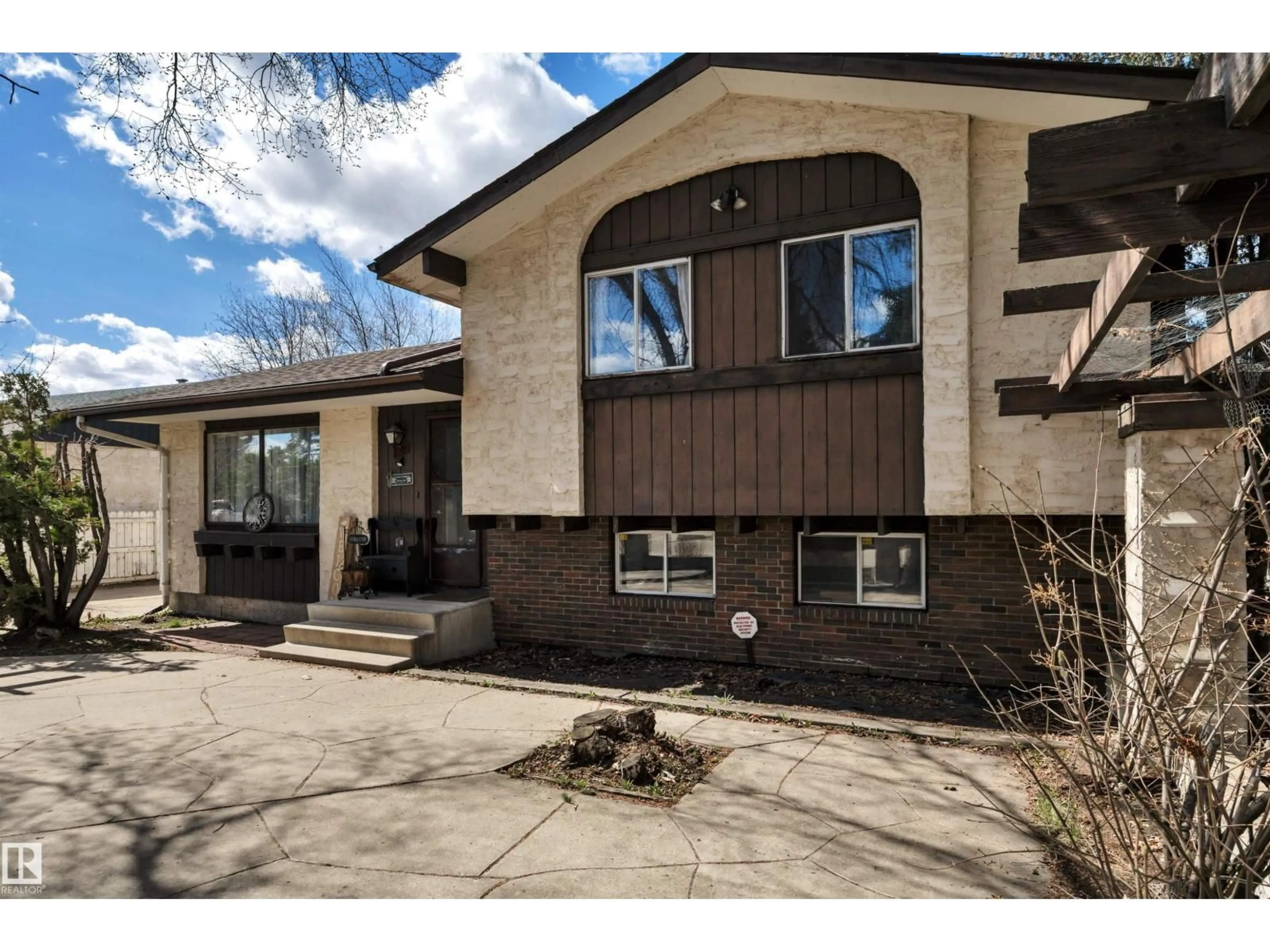 Home with brick exterior material, street for 5718 GARDEN MEADOWS DRIVE, Wetaskiwin Alberta T9A2L6