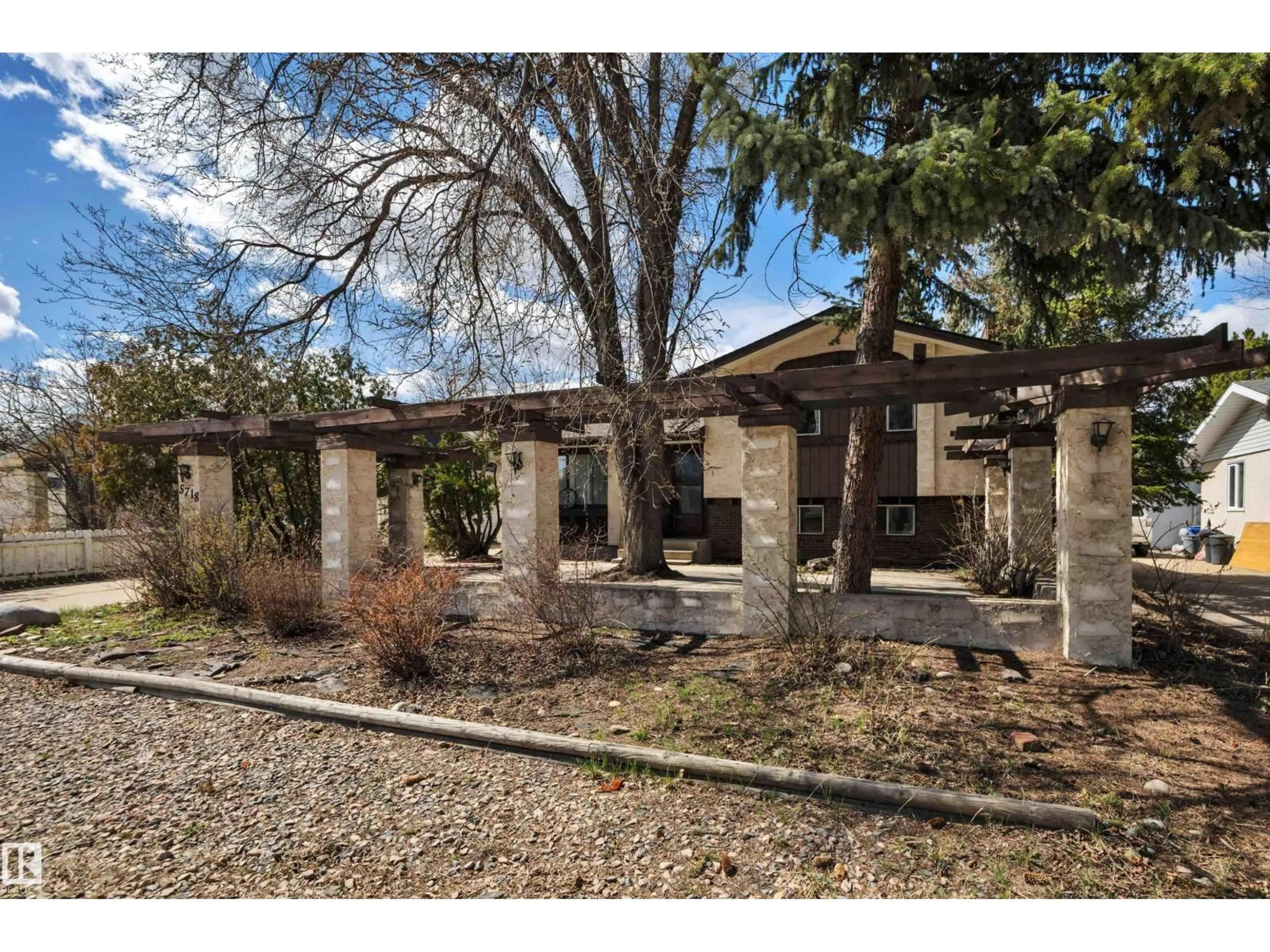 Home with brick exterior material, street for 5718 GARDEN MEADOWS DRIVE, Wetaskiwin Alberta T9A2L6