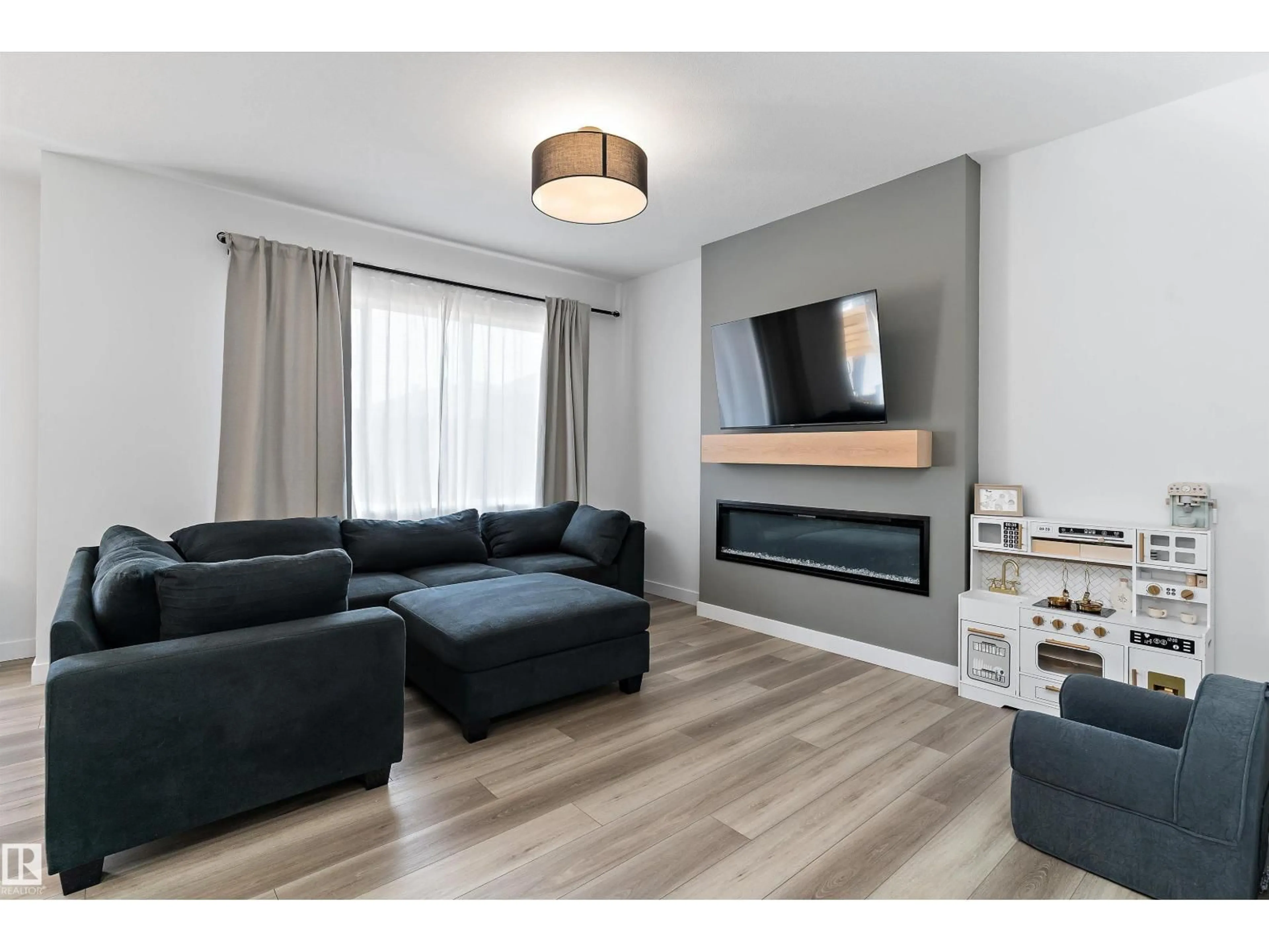 Living room with furniture, wood/laminate floor for 13 RESPLENDENT WY, St. Albert Alberta T8N8B3