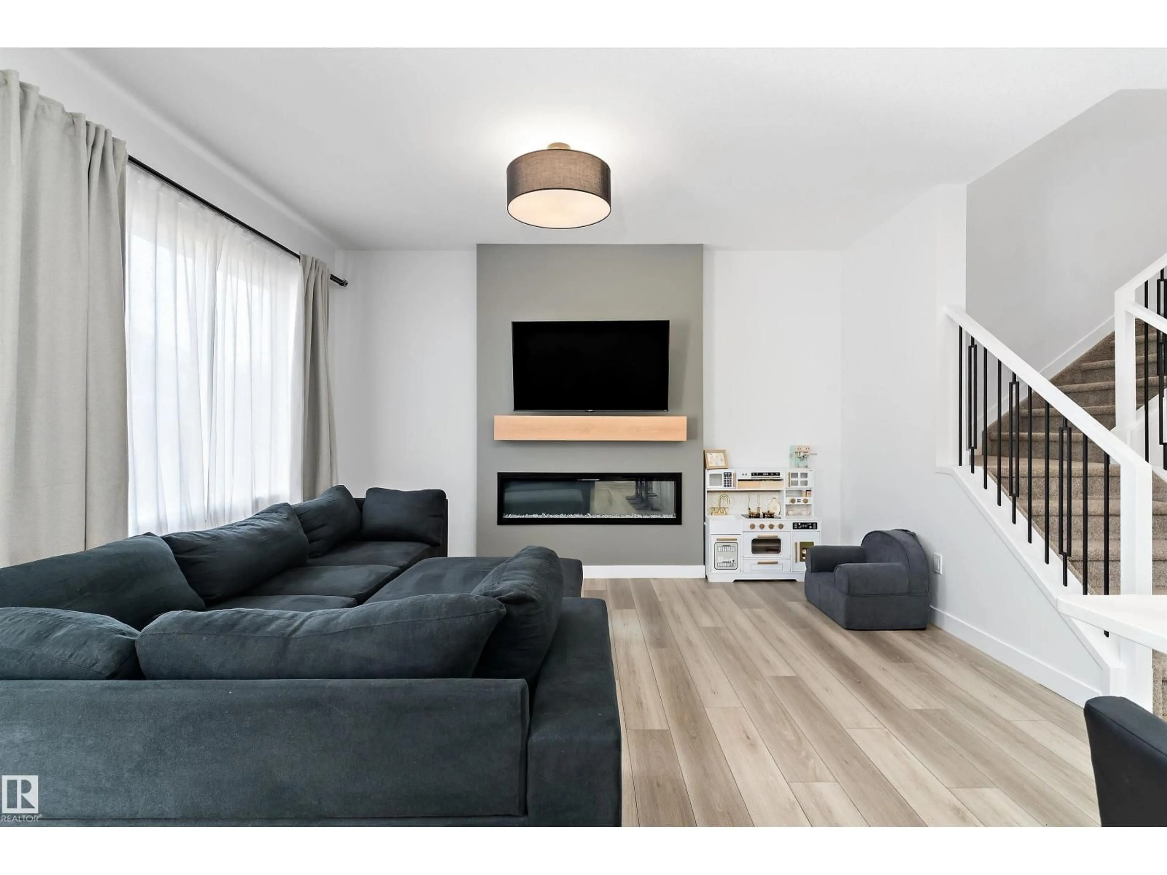 Living room with furniture, wood/laminate floor for 13 RESPLENDENT WY, St. Albert Alberta T8N8B3