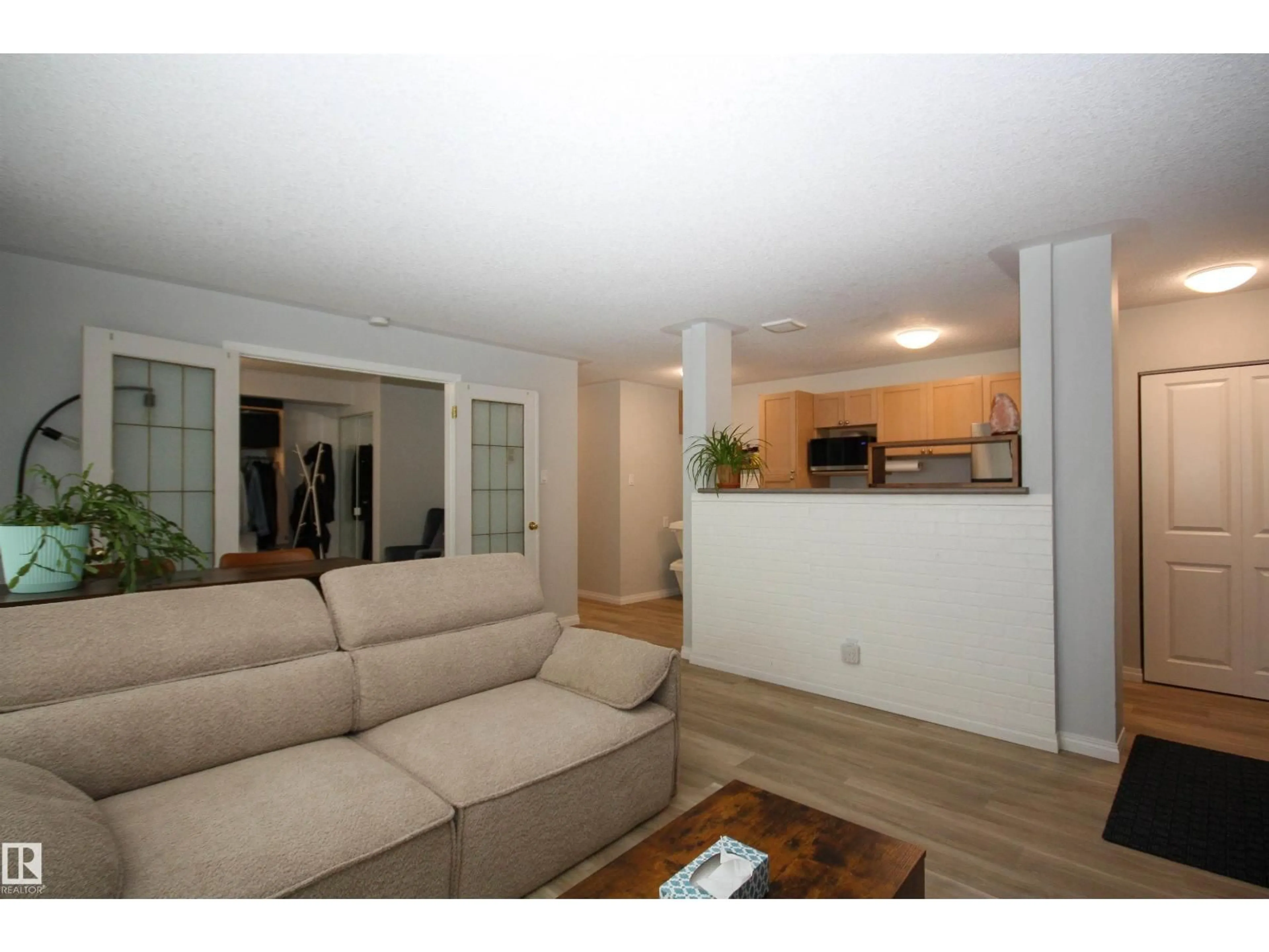 Living room with furniture, wood/laminate floor for NW - 11008 124 ST, Edmonton Alberta T5M0J4