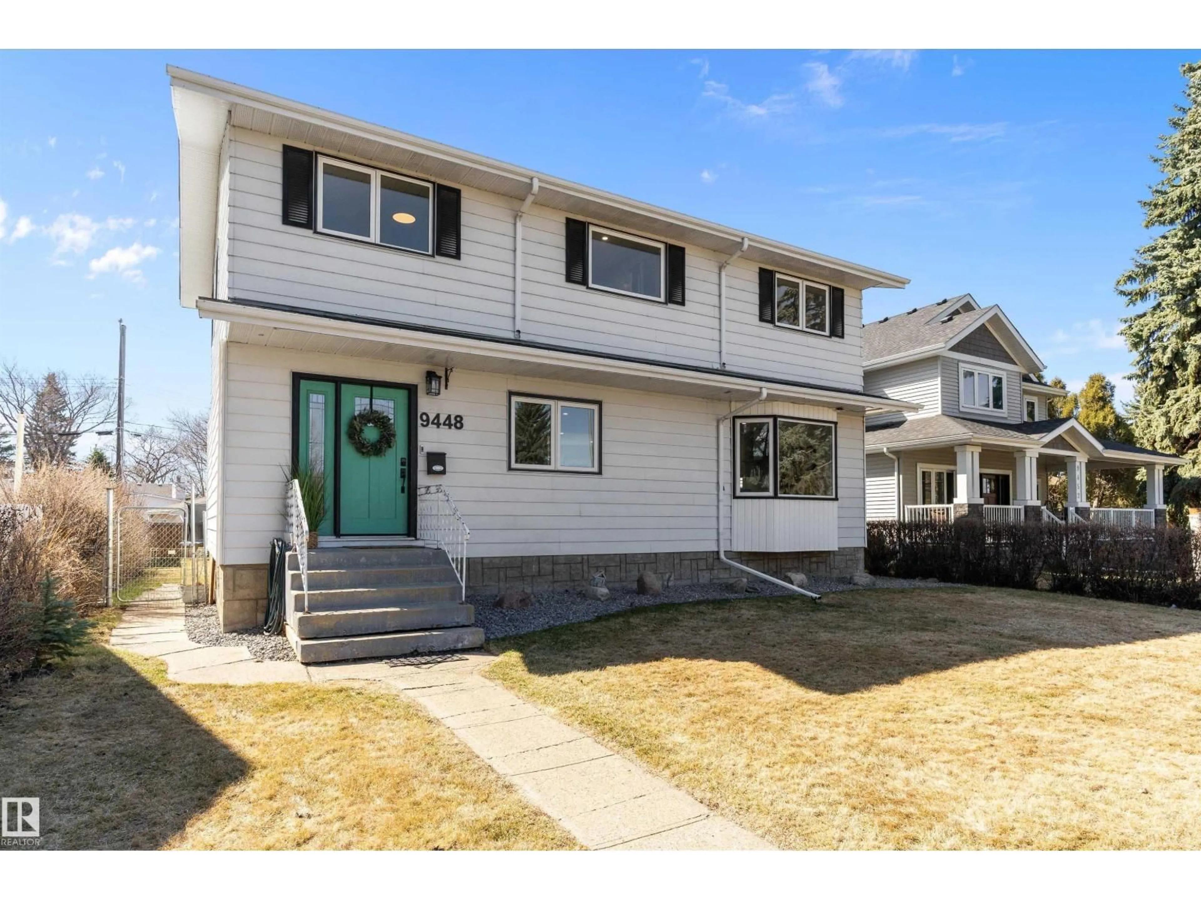 Home with vinyl exterior material, street for NW - 9448 76 ST, Edmonton Alberta T6C2K6