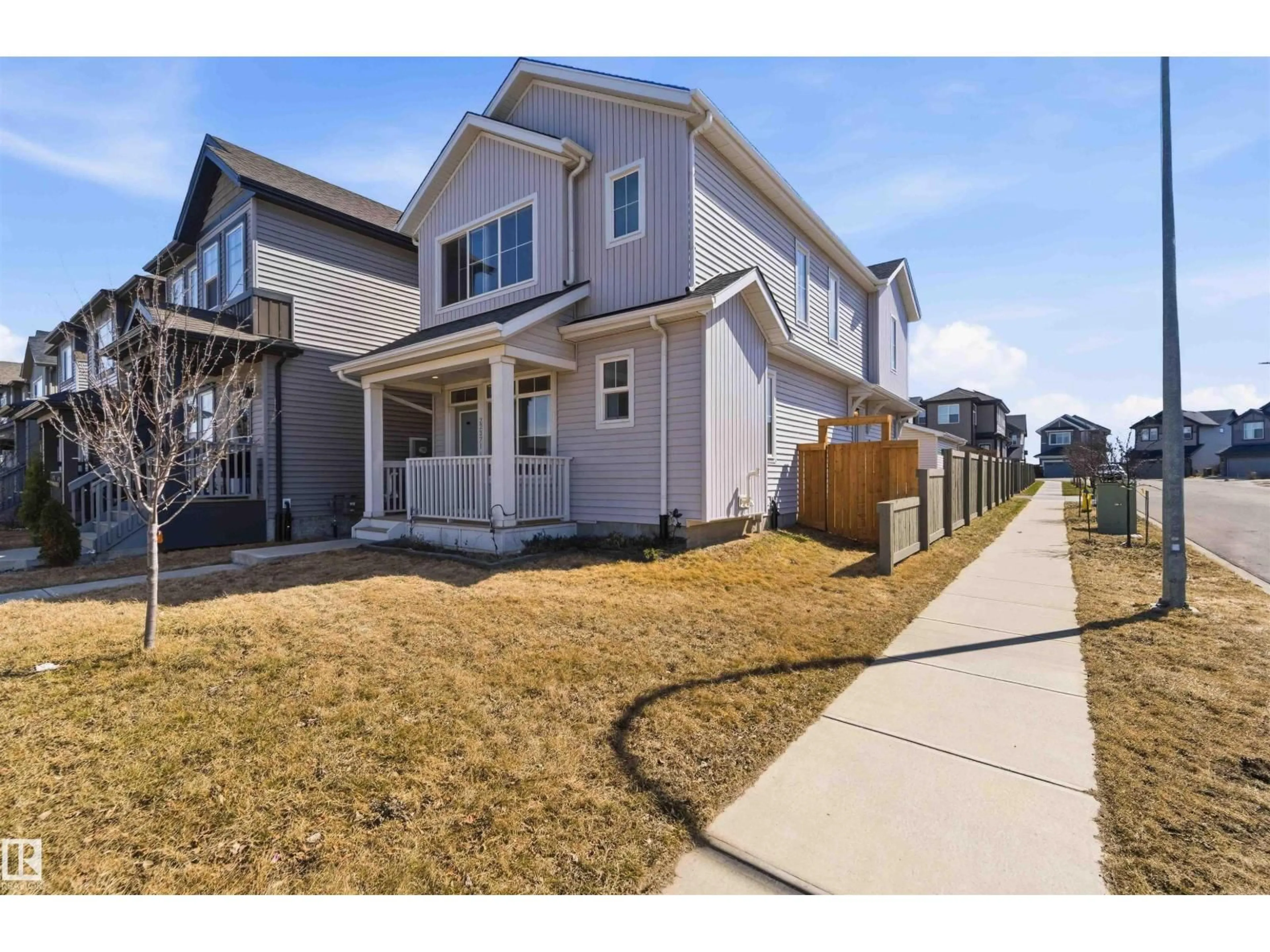 Home with vinyl exterior material, street for 22371 93 AV, Edmonton Alberta T5T7L9