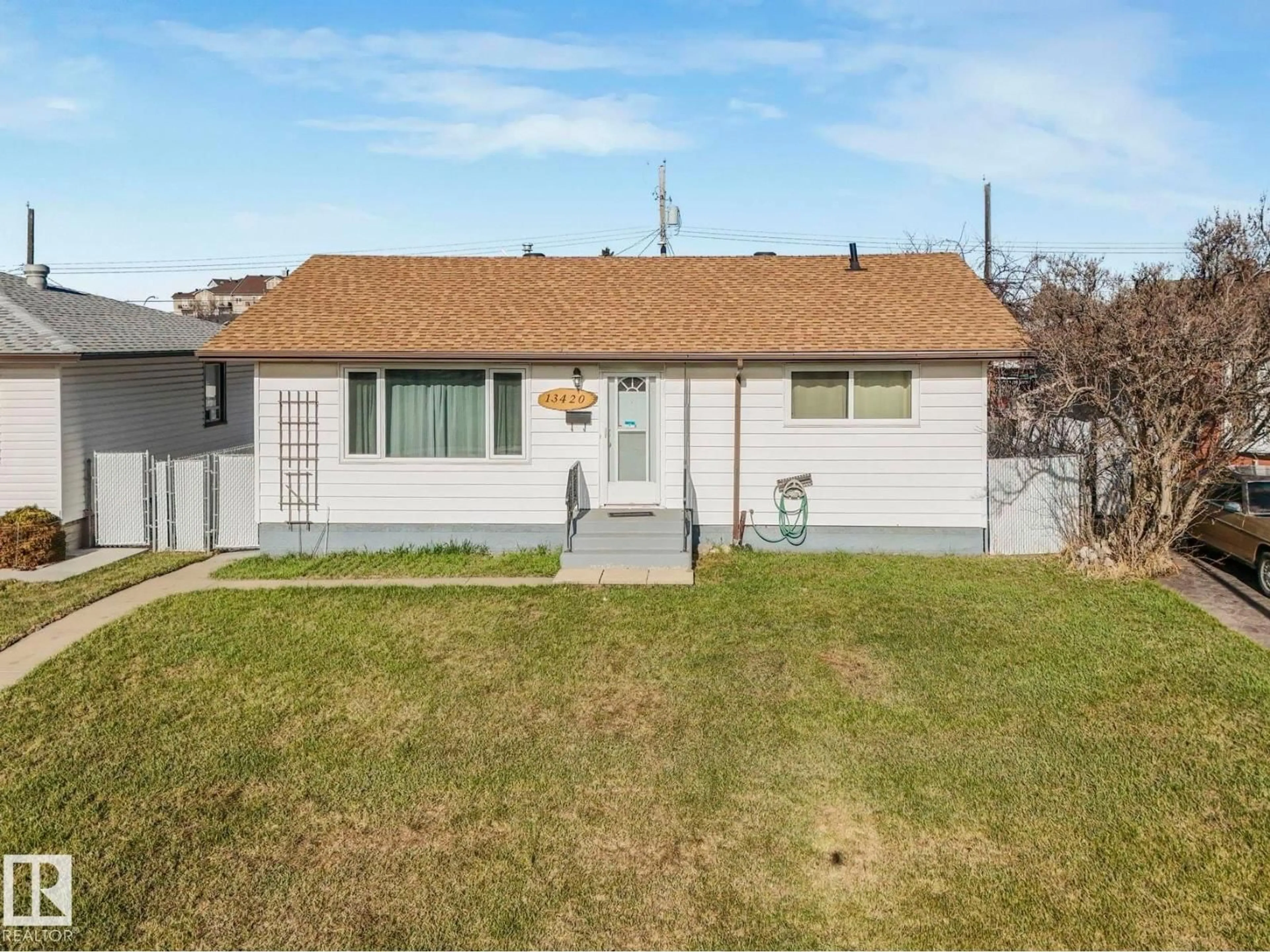 Home with vinyl exterior material, street for 13420 60 ST, Edmonton Alberta T5A0S6