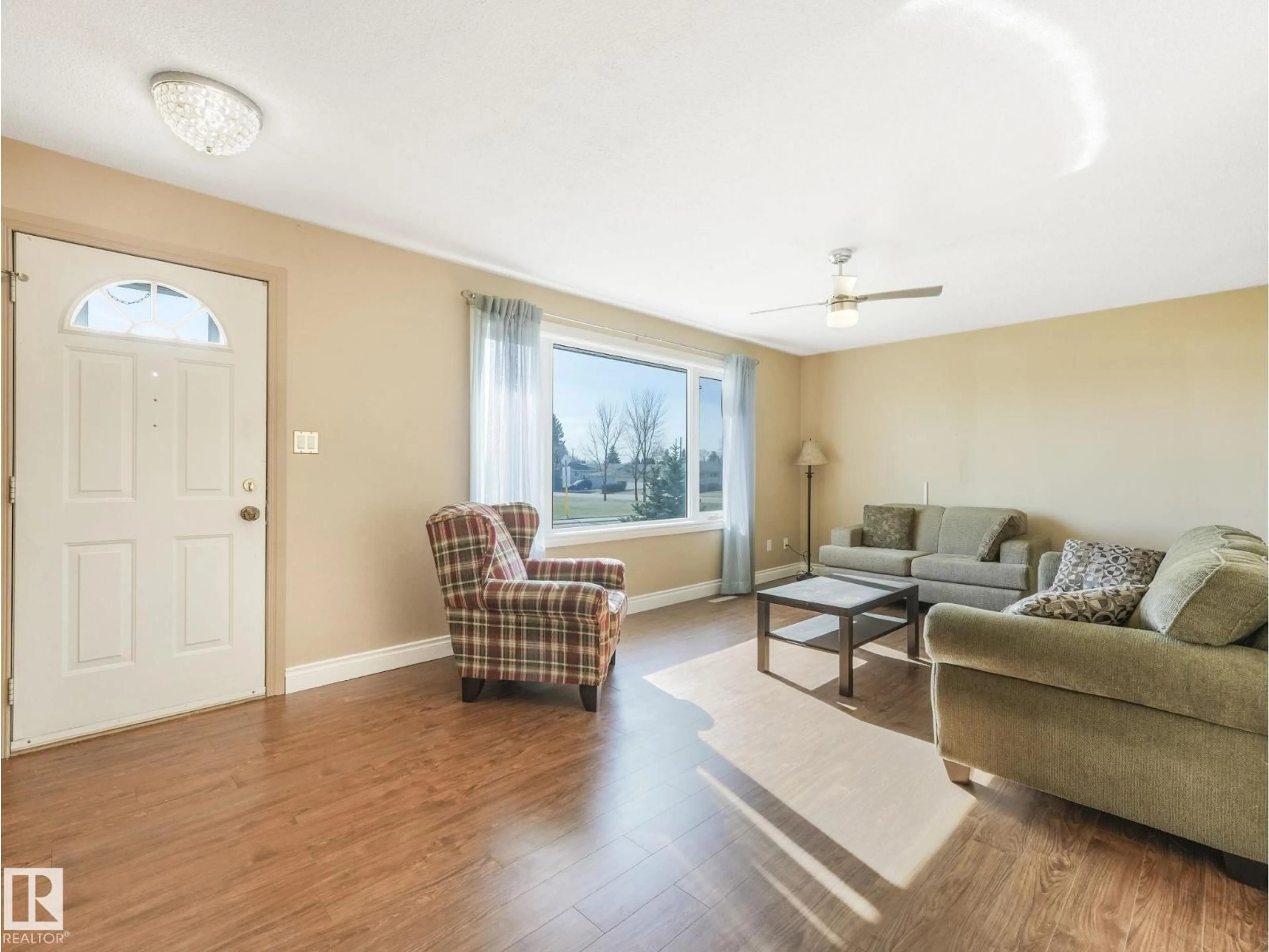 Living room with furniture, wood/laminate floor for 13420 60 ST, Edmonton Alberta T5A0S6