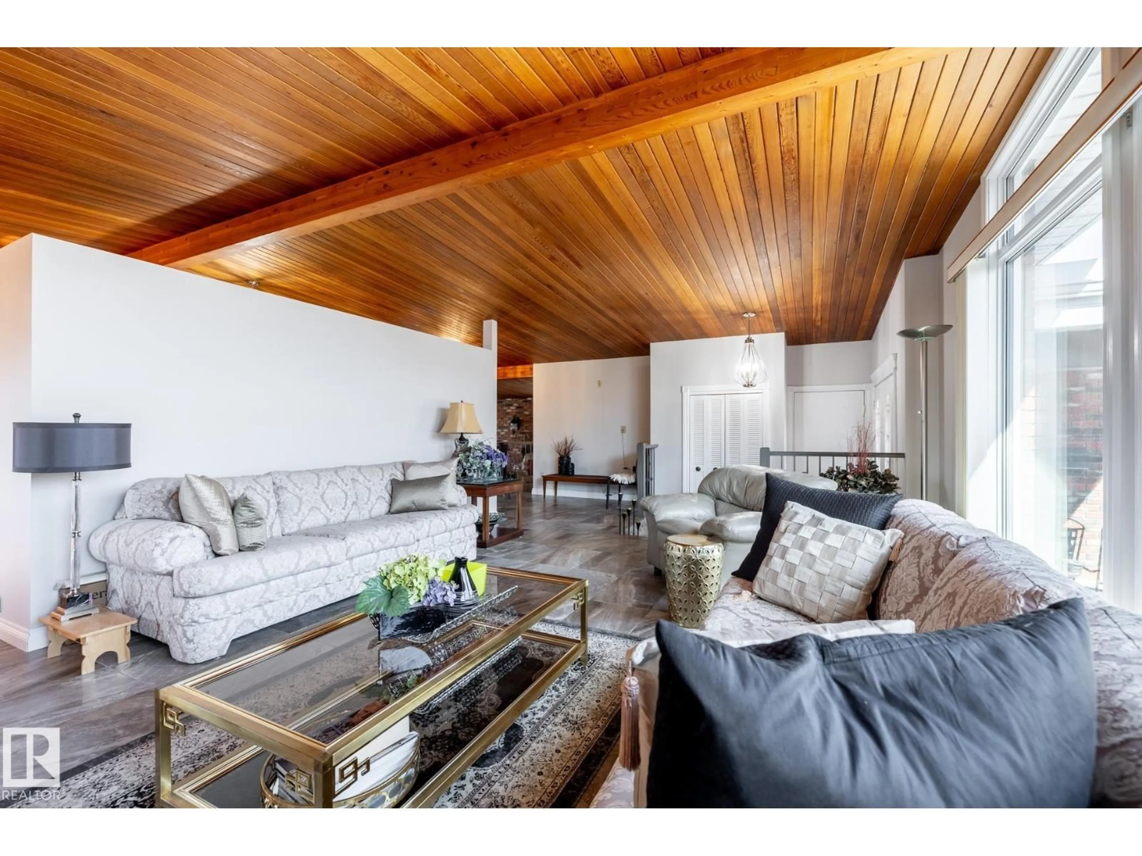 Living room with furniture, wood/laminate floor for 16536 103 ST, Edmonton Alberta T5X2H4