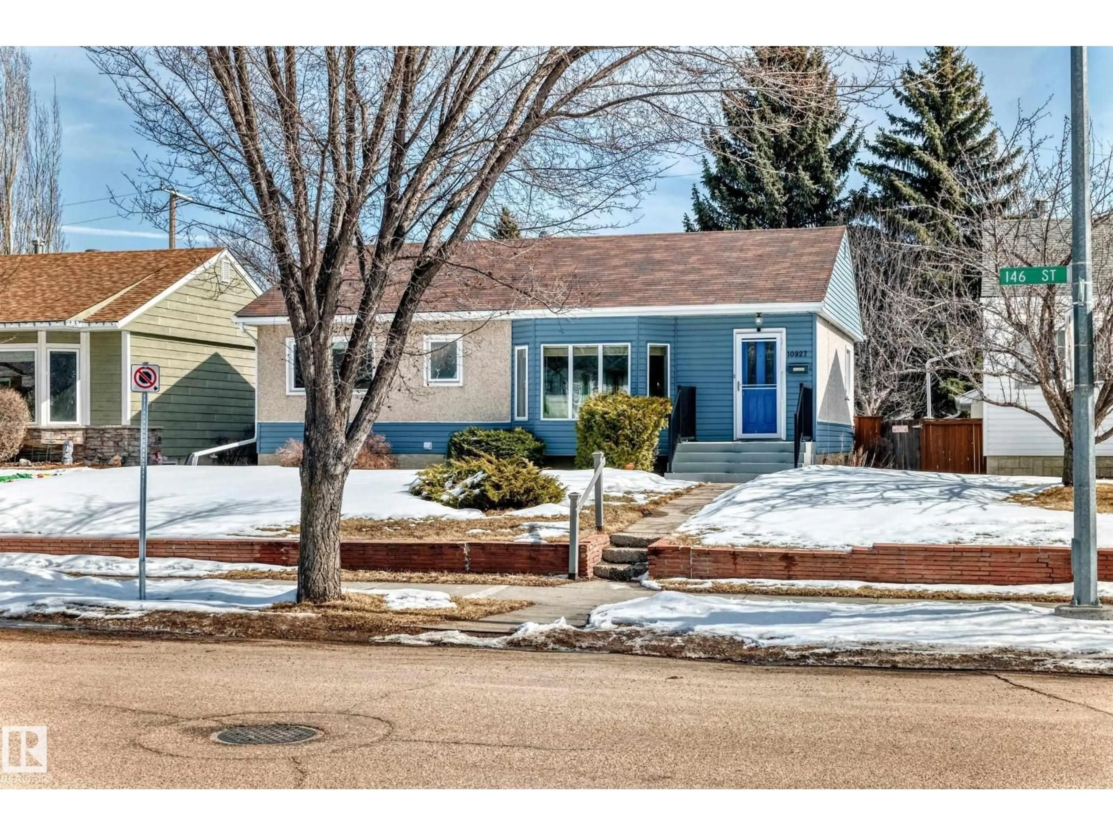 Home with vinyl exterior material, street for NW - 10927 146 ST, Edmonton Alberta T5N3A8