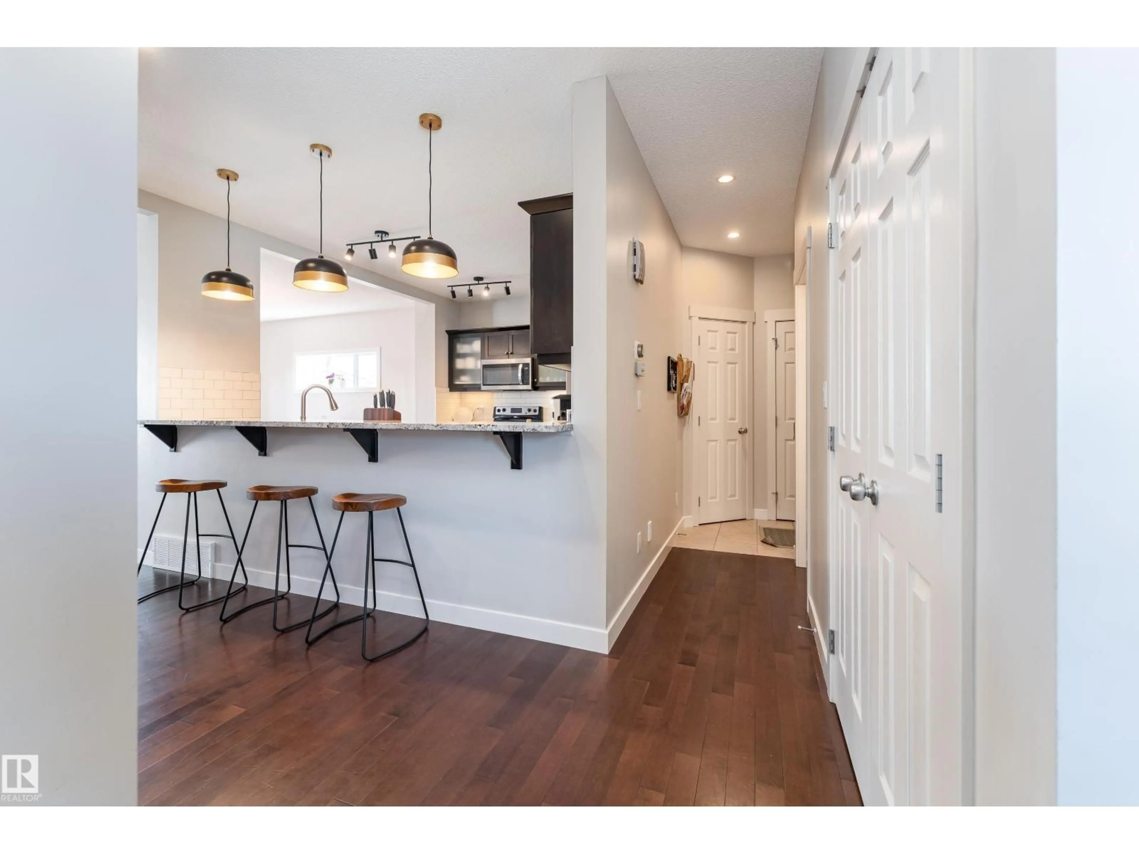 Open concept kitchen, wood/laminate floor for 22064 95 AV, Edmonton Alberta T5T4A7