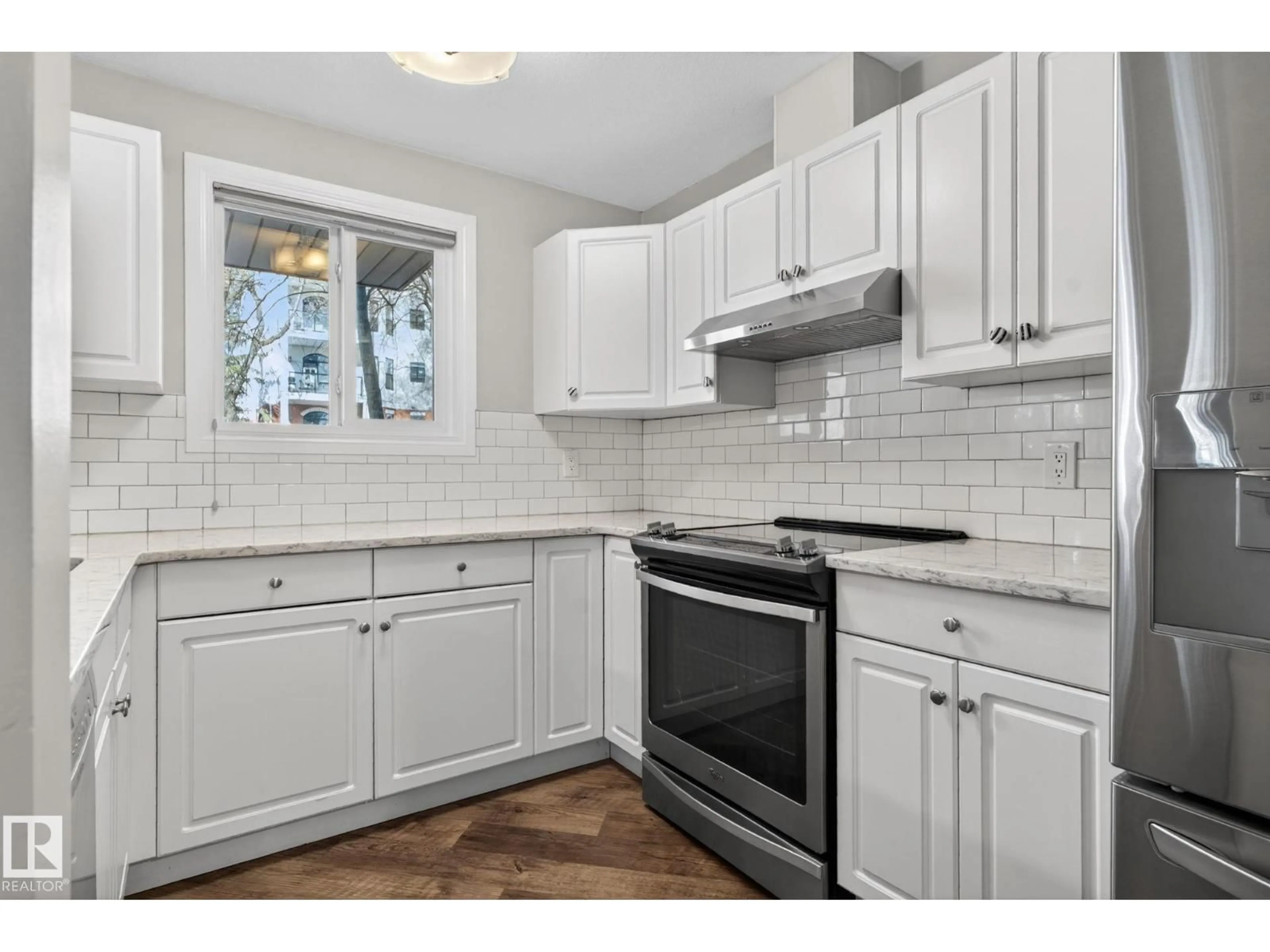 Open concept kitchen, ceramic/tile floor for 113 10153 117 ST NW, Edmonton Alberta T5K1X5