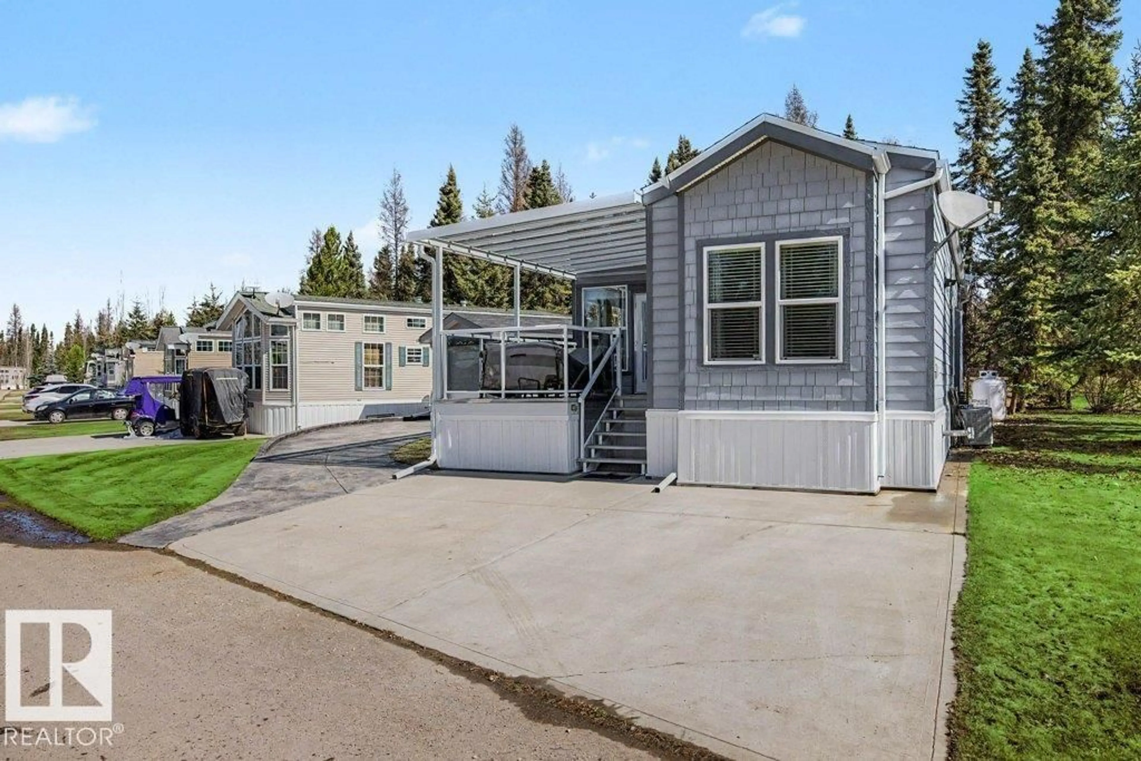 Home with vinyl exterior material, street for 53126 - 143 RGE ROAD 70, Rural Parkland County Alberta T0E0S0