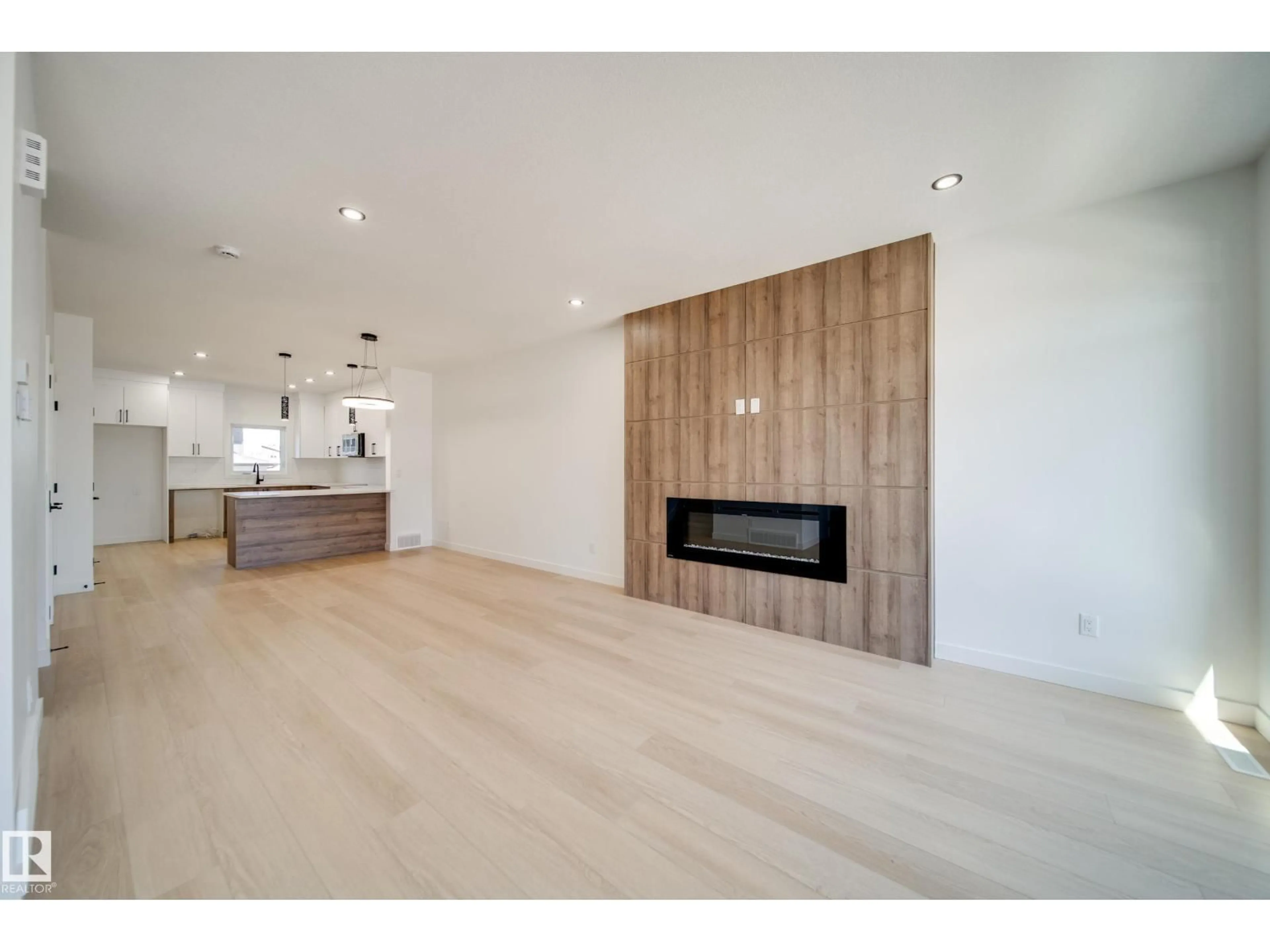 Open concept kitchen, wood/laminate floor for E - 92 BLACKBIRD BEND, Fort Saskatchewan Alberta T8L0G6
