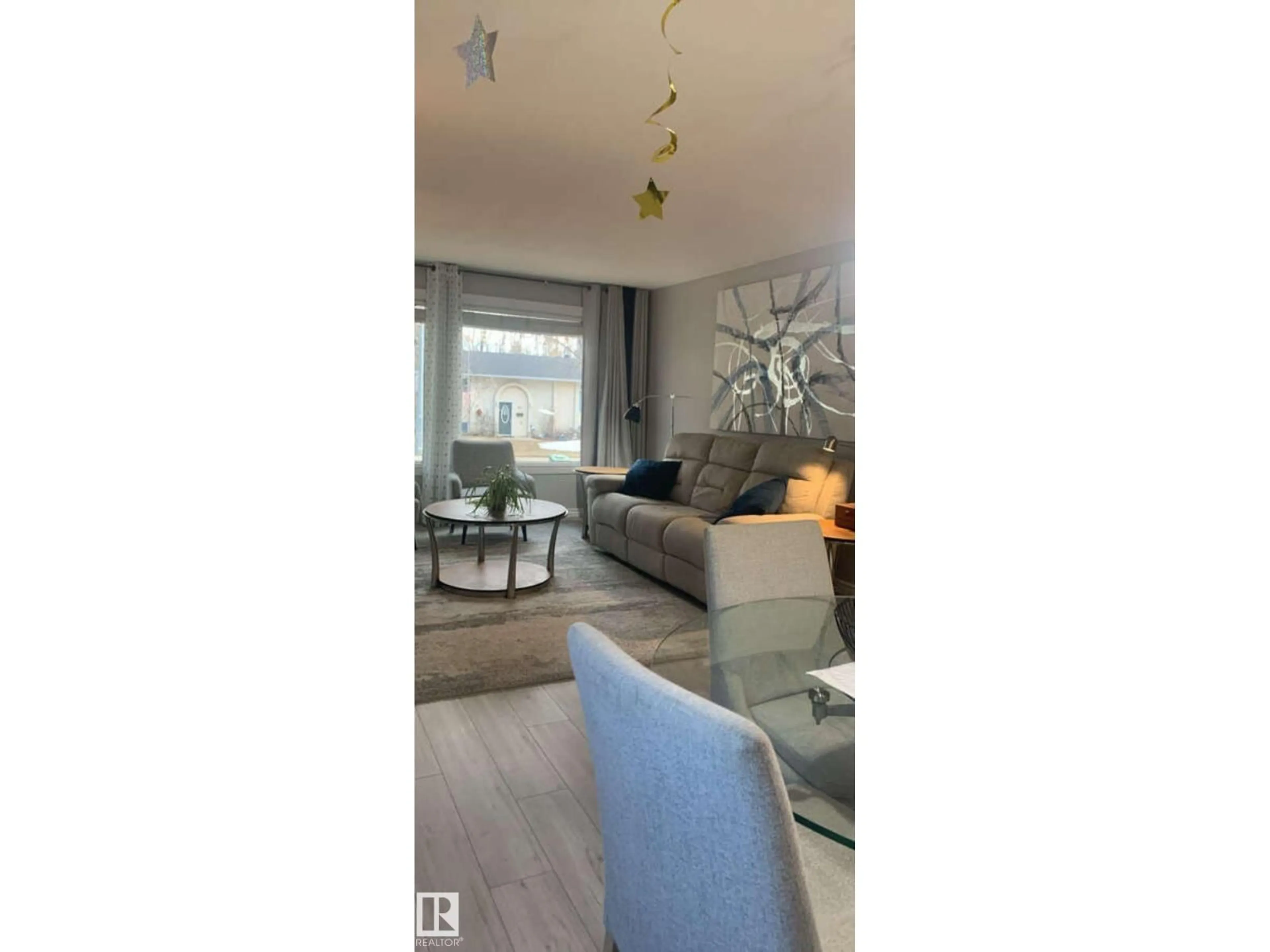Living room with furniture, wood/laminate floor for 83 LORRAINE CR, St. Albert Alberta T8N2R4