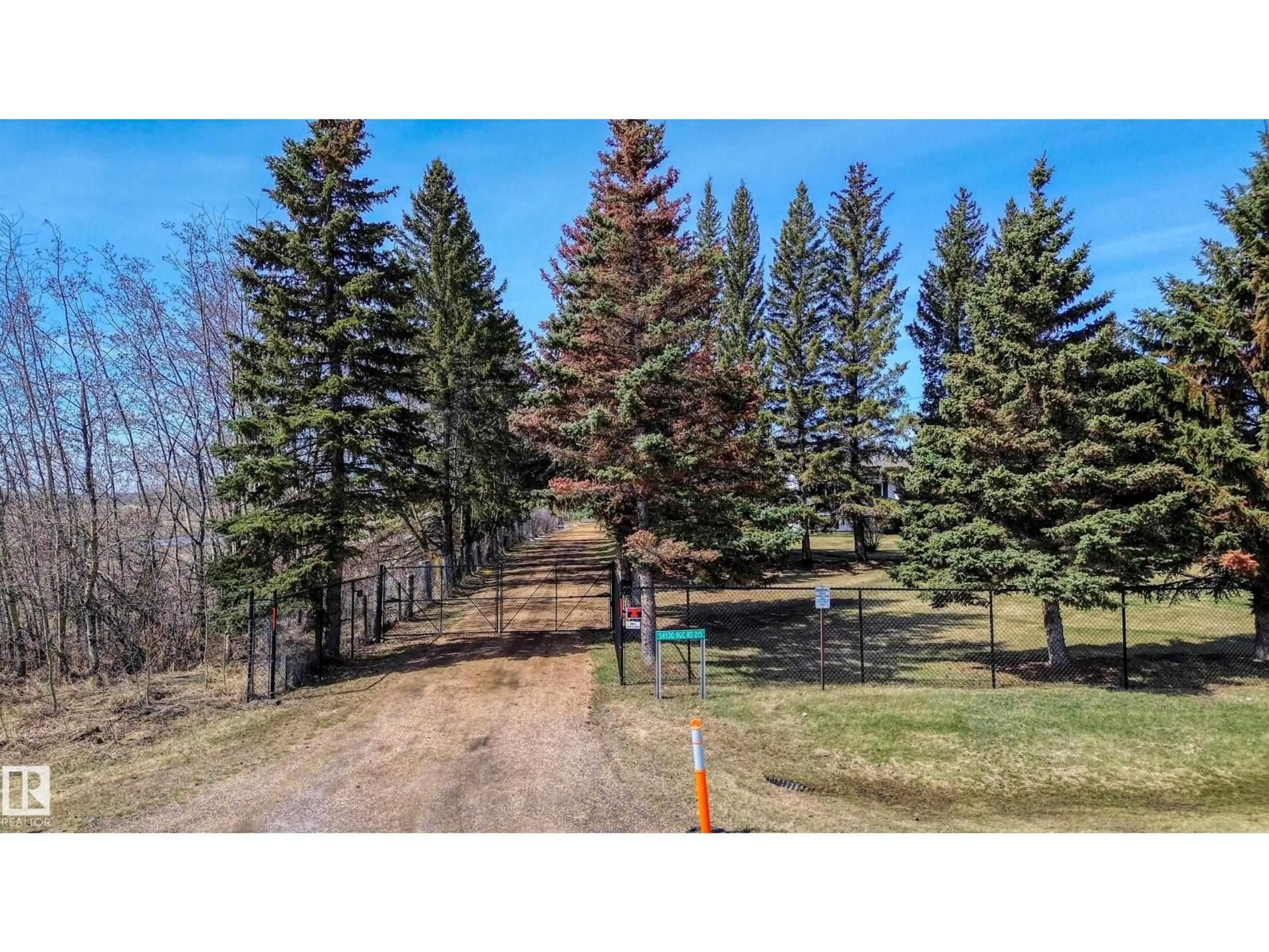 A pic from outside/outdoor area/front of a property/back of a property/a pic from drone, forest/trees view for 54530 RGE ROAD 215, Rural Strathcona County Alberta T8L4B9