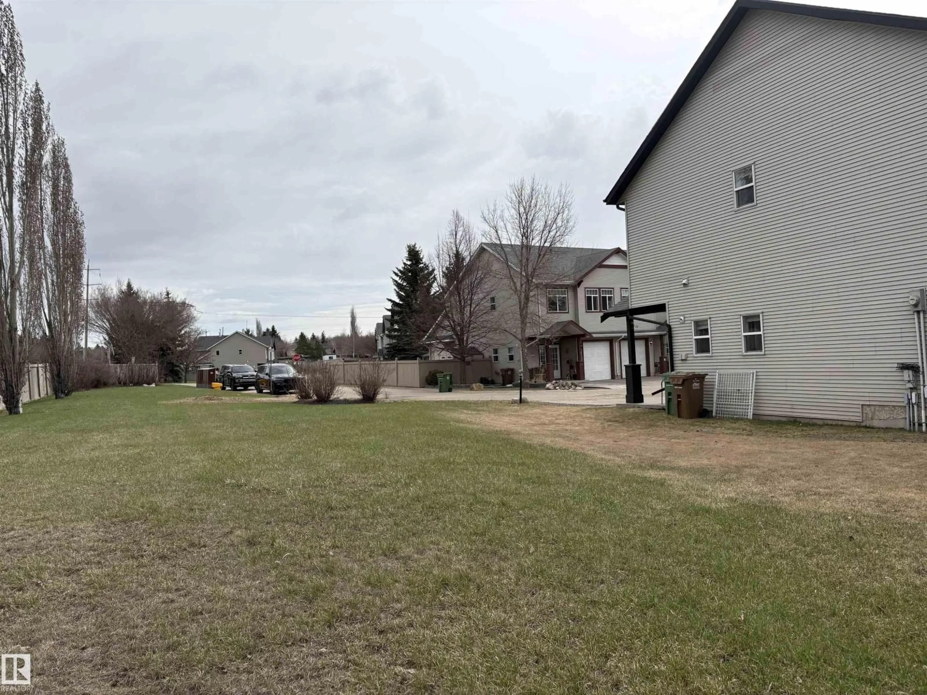 A pic from outside/outdoor area/front of a property/back of a property/a pic from drone, mountain view for 30 - 1 LEVASSEUR RD, St. Albert Alberta T8N7A6